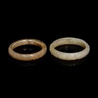 Two Chinese Carved Precious Stone Bangles, Qing Dynasty or Earlier 清或以前 青玉、瑪瑙雕螭龍紋鐲各一