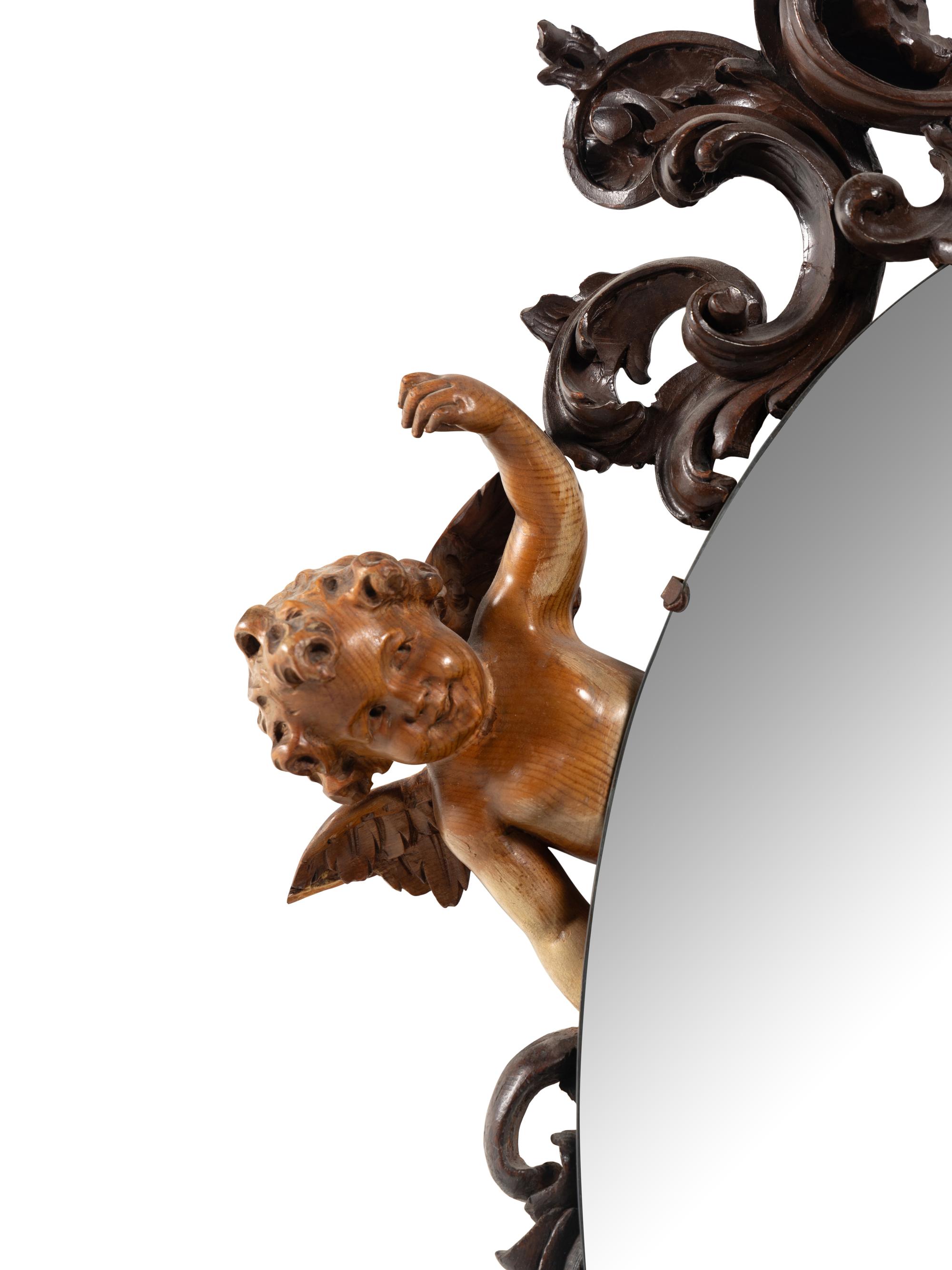 A Venetian Carved Walnut Mirror