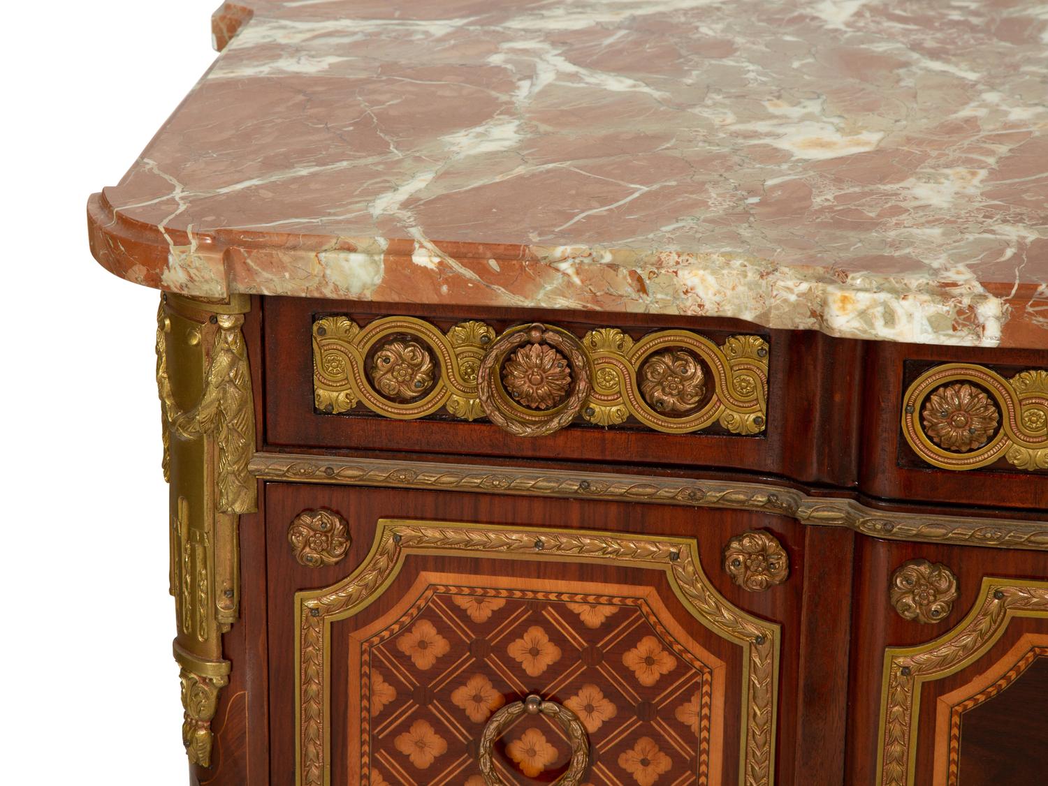 A Louis XV/XVI Transitional Style Gilt Metal Mounted Marquetry Marble-Top Commode