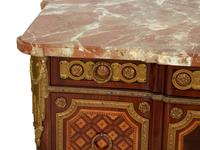 A Louis XV/XVI Transitional Style Gilt Metal Mounted Marquetry Marble-Top Commode