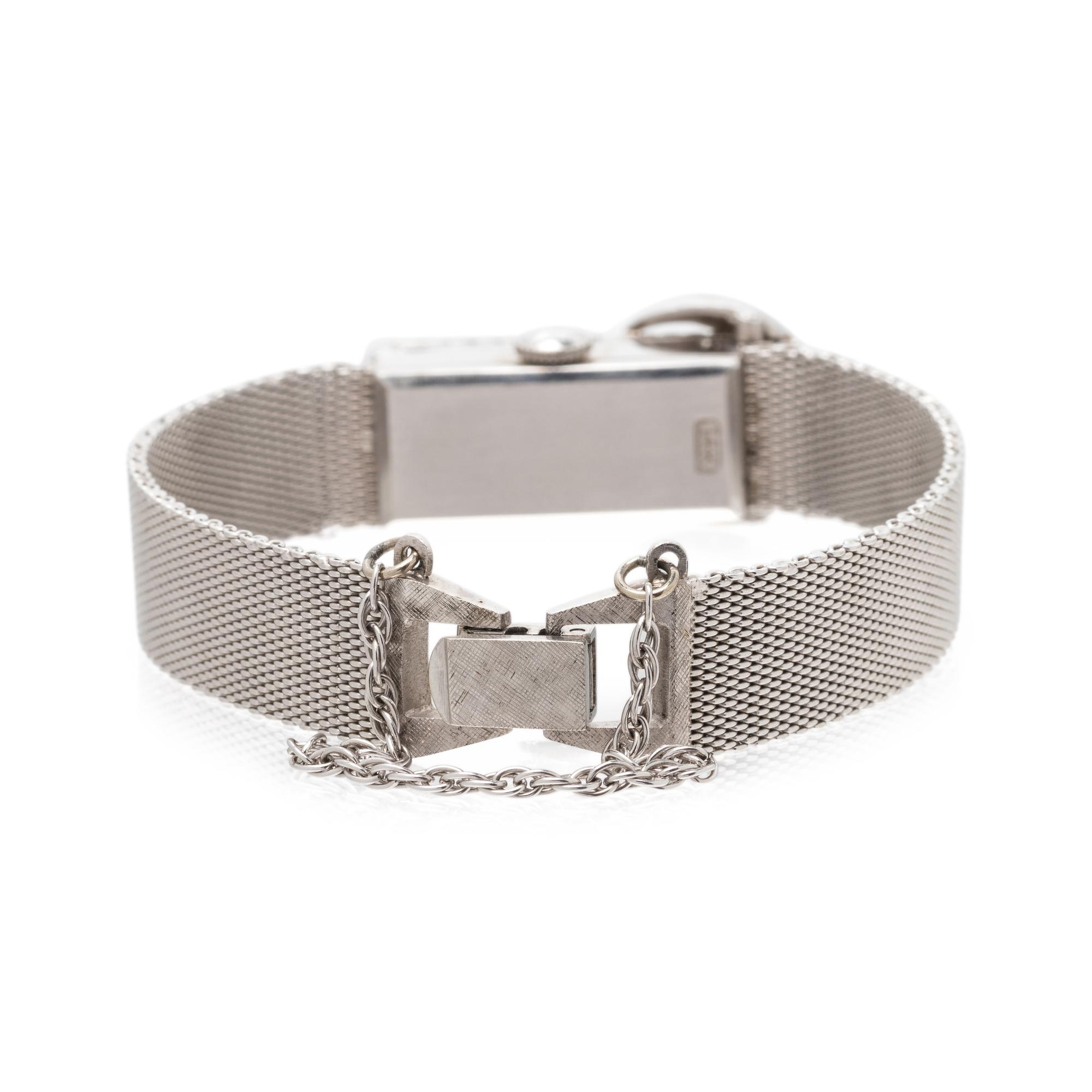 BAUME & MERCIER, 14K WHITE GOLD AND DIAMOND SURPRISE WRISTWATCH