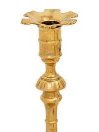 A Group of Eight English Brass Candlesticks