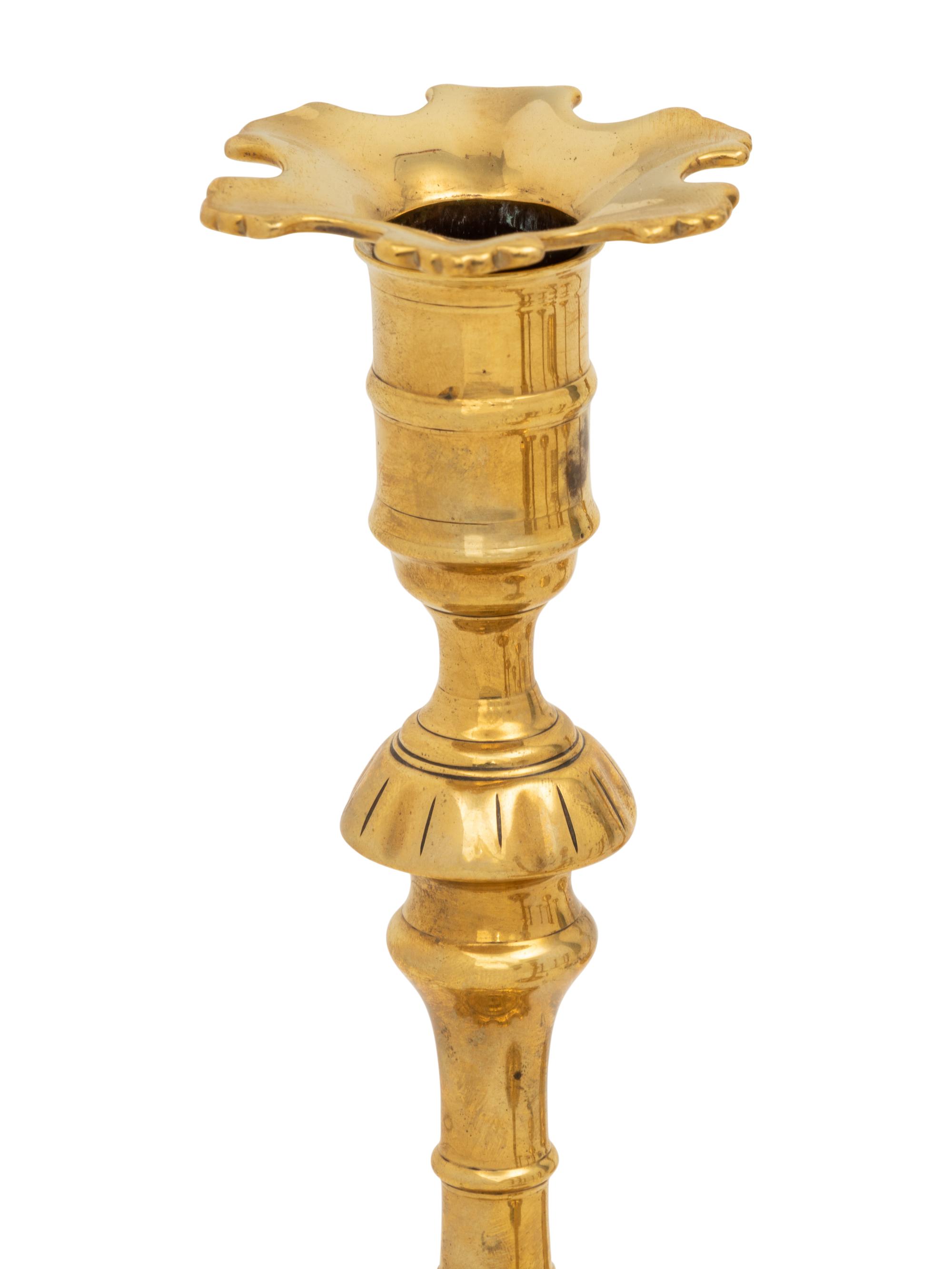 A Group of Eight English Brass Candlesticks