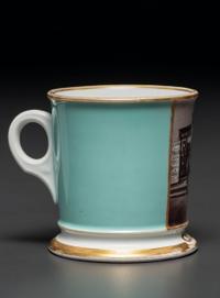 A Paint Enhanced Photographic Transfer Porcelain Occupational Shaving Mug Depicting a Tailor's Shop