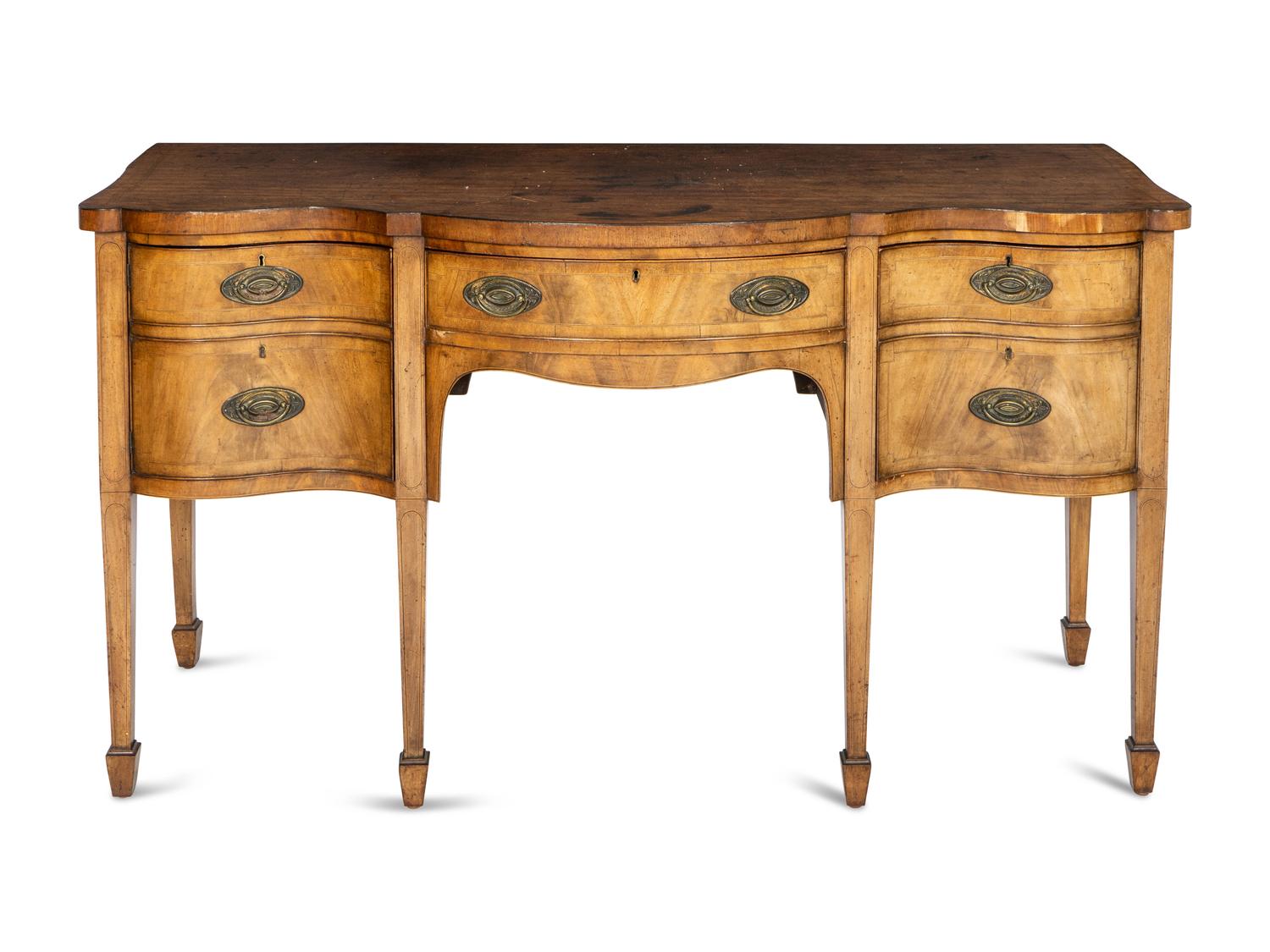 A George III Walnut and Mahogany Serpentine Sideboard