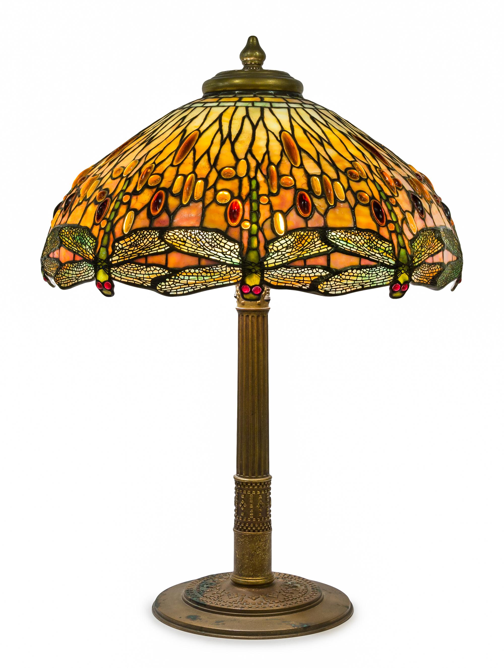 A Tiffany Studios Favrile Glass and Gilt Bronze Drophead Dragonfly Table Lamp Diameter of shade 22 1/2 inches, height overall 31 inches