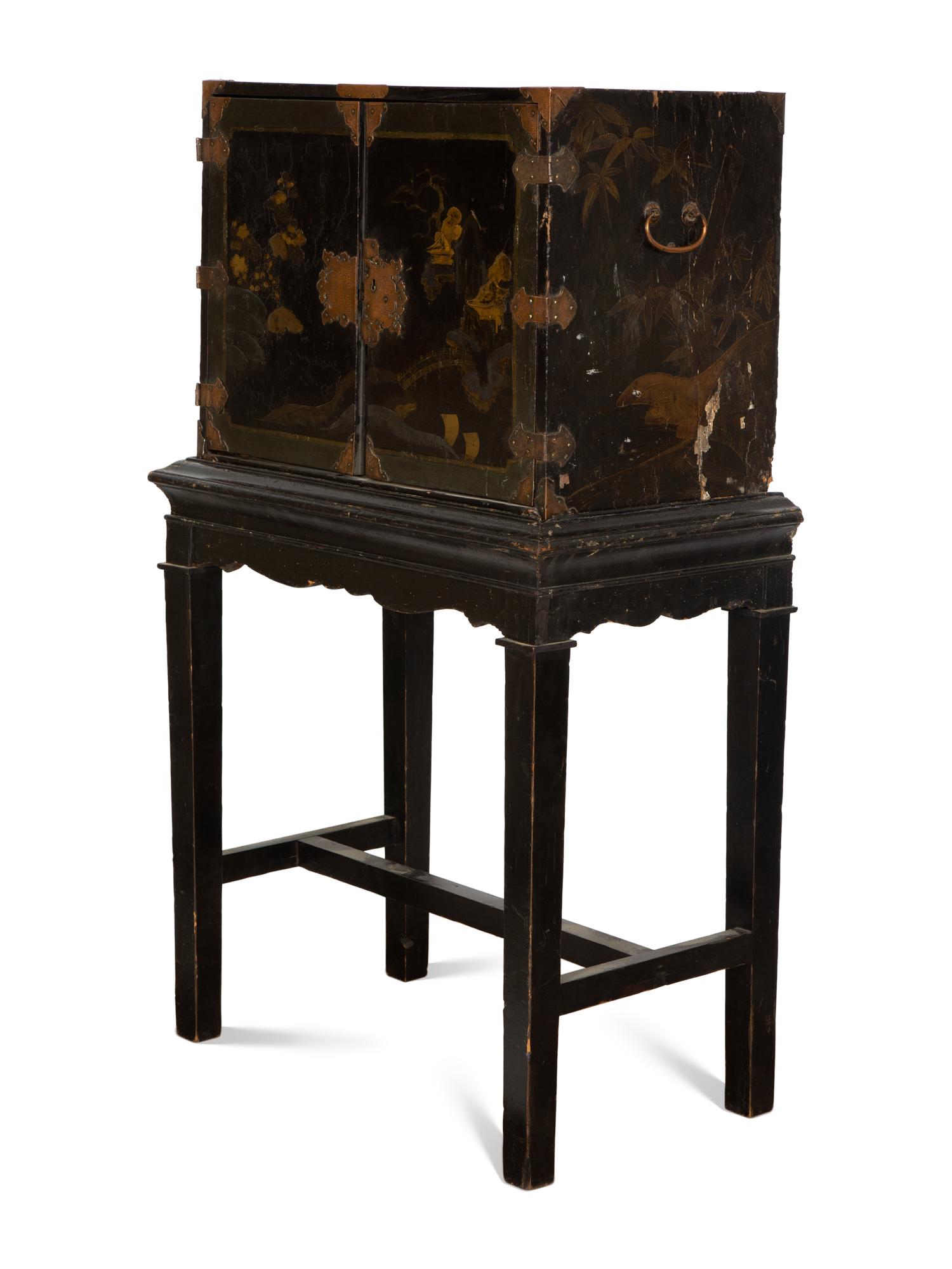 A Chinese Black and Gilt Lacquered Cabinet on Stand