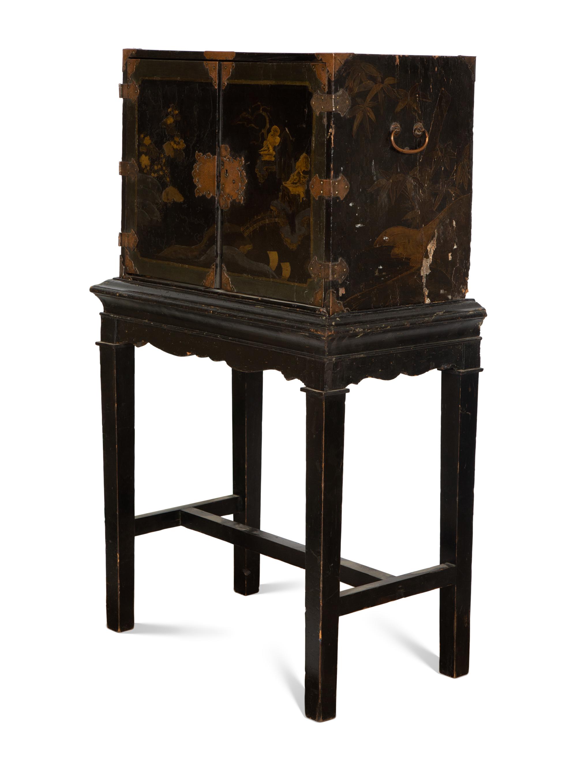 A Chinese Black and Gilt Lacquered Cabinet on Stand