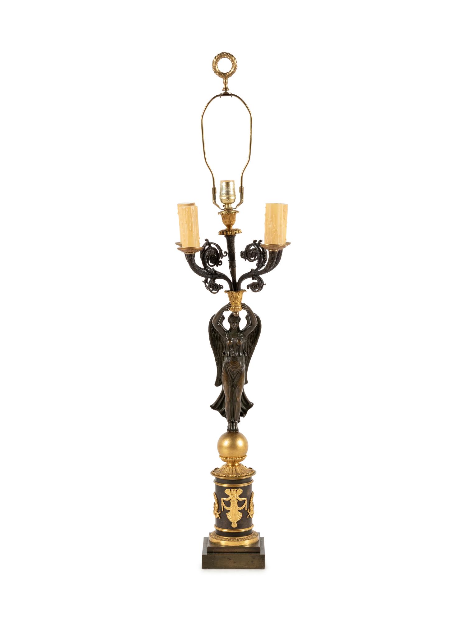 An Empire Style Gilt and Patinated Bronze Figural Five-Light Candelabrum