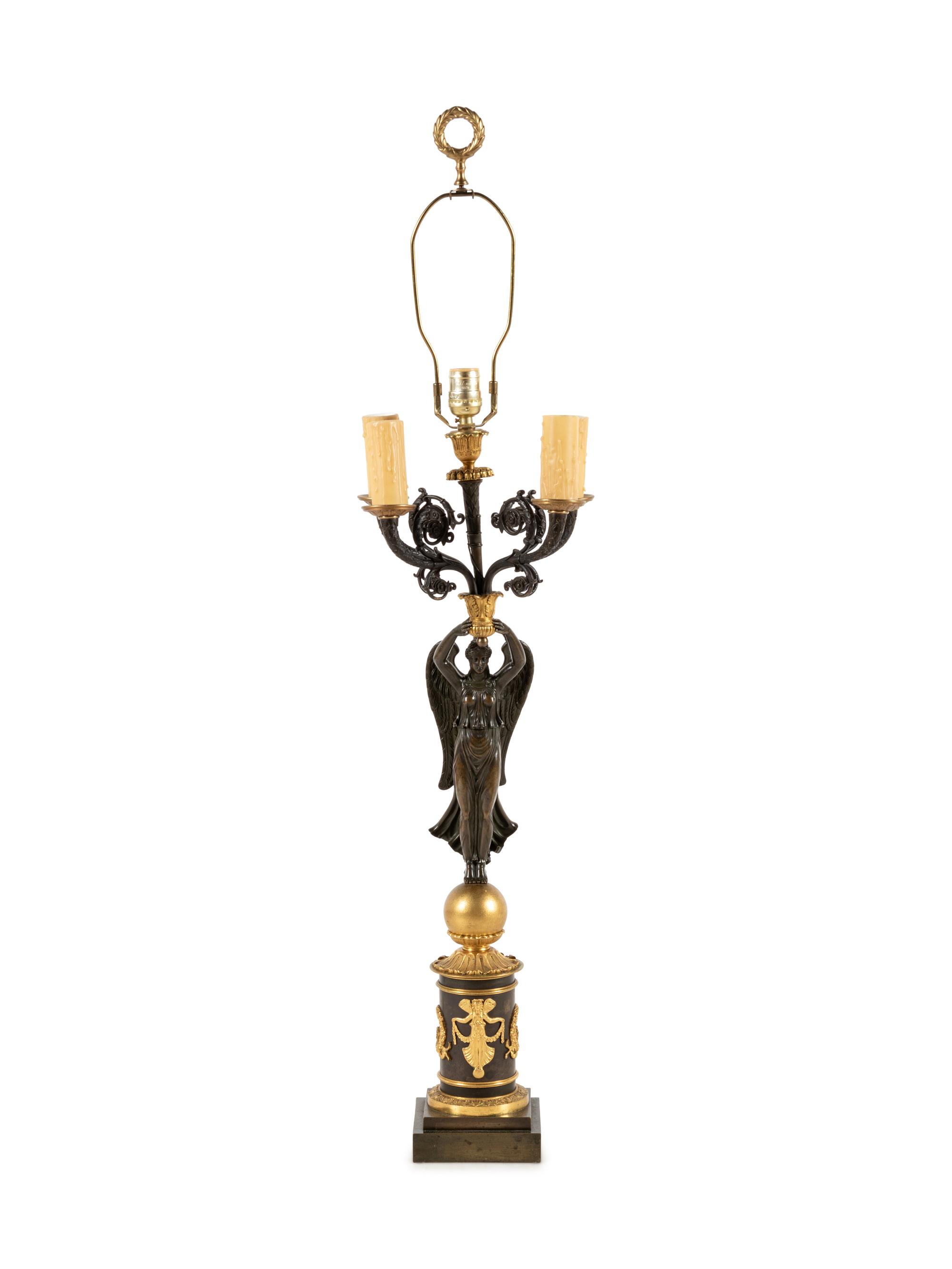An Empire Style Gilt and Patinated Bronze Figural Five-Light Candelabrum