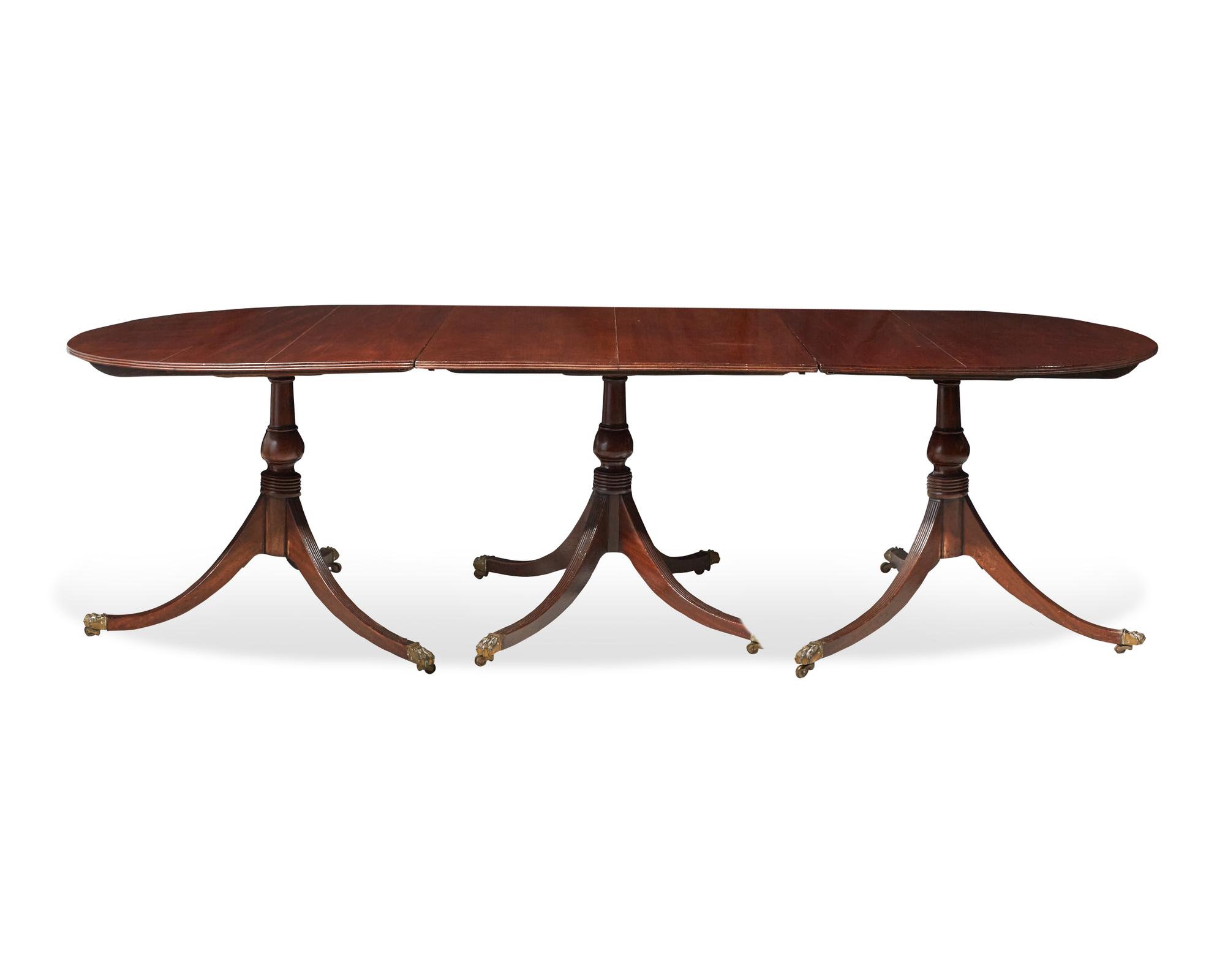 A George III three-part mahogany dining table, circa 1800