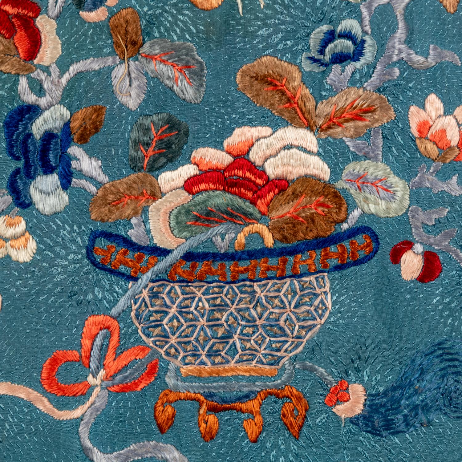 A Chinese Celeste Blue Ground Embroidered Silk Lady's Jacket 清晚期 藍地牡丹花籃紋褂