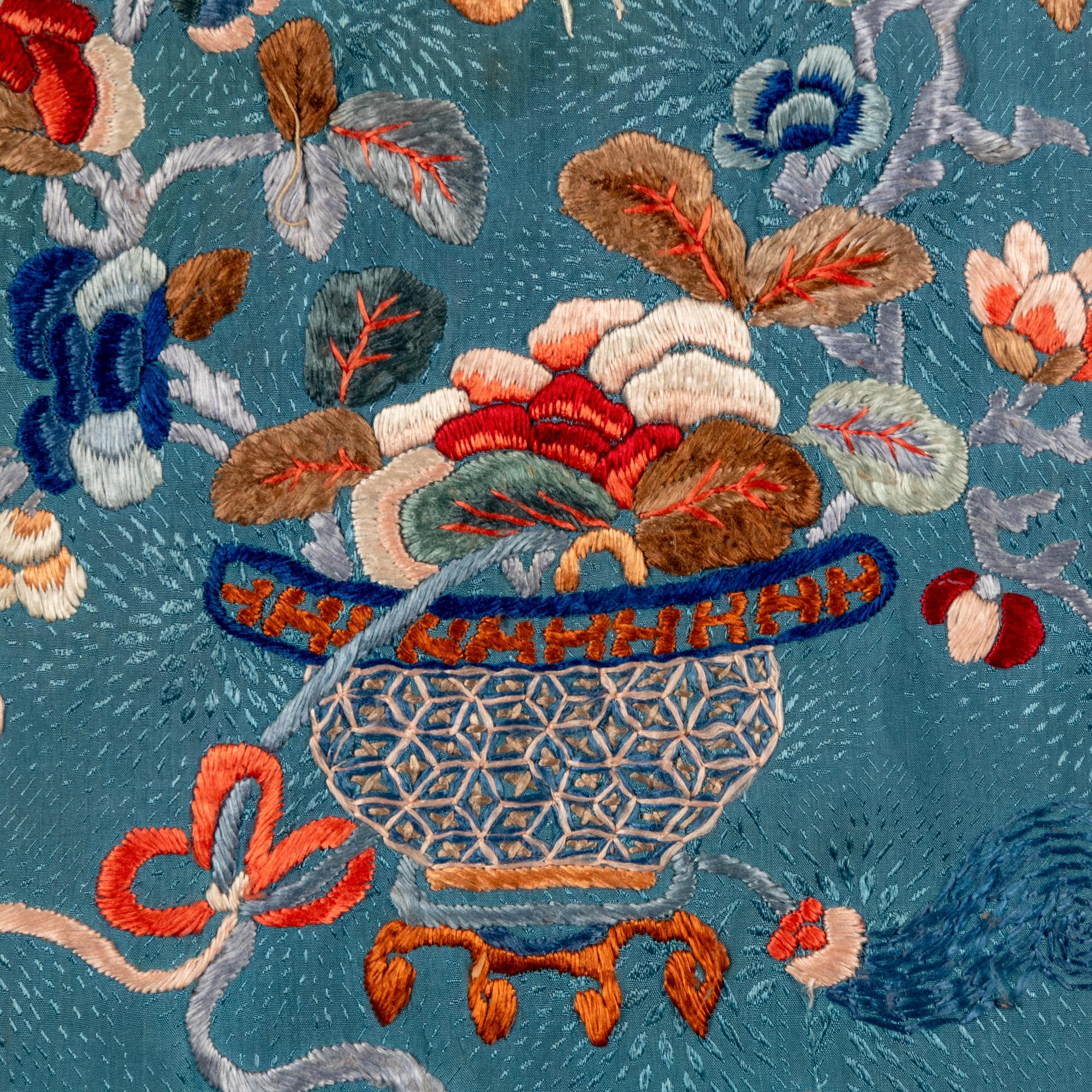 A Chinese Celeste Blue Ground Embroidered Silk Lady's Jacket 清晚期 藍地牡丹花籃紋褂