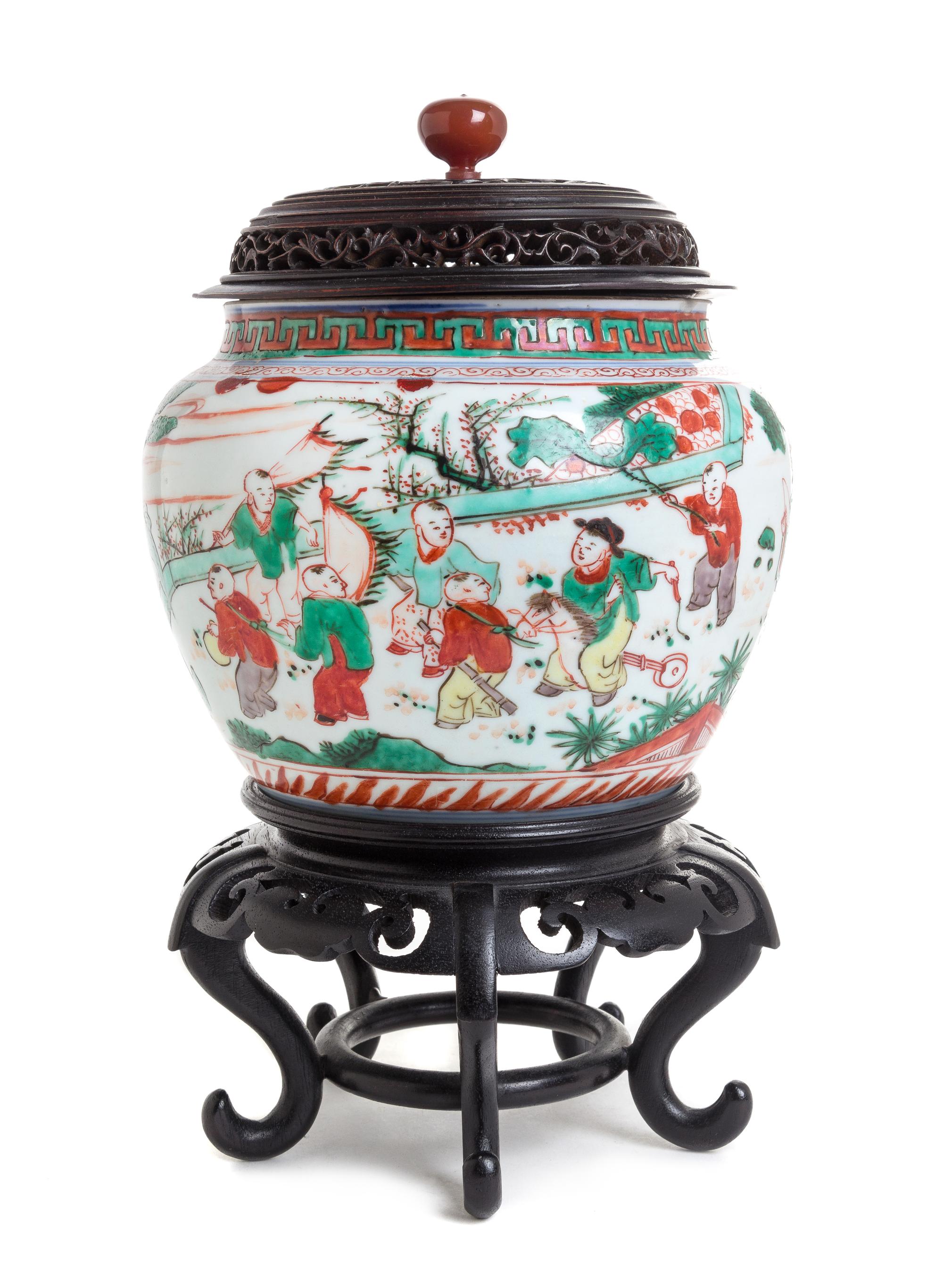 A Wucai Porcelain Jar Height 5 3/4 inches.