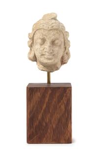 A Gandharan Stucco Head of a Warrior Height 2 inches.