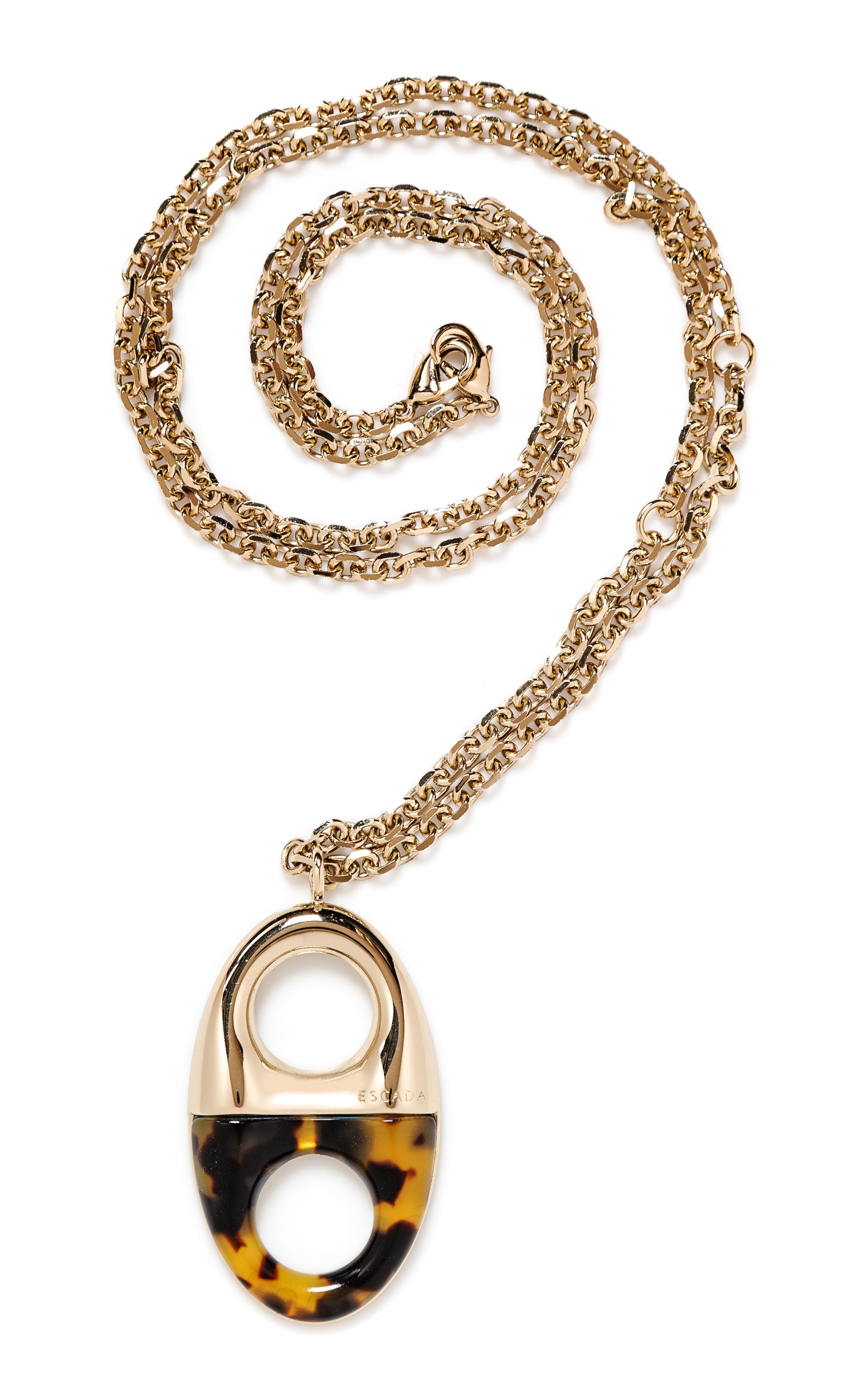 An Escada Goldtone and Faux Tortoiseshell Long Pendant Necklace, Length: 44"; Pendant: 3" L x 1.75" W.