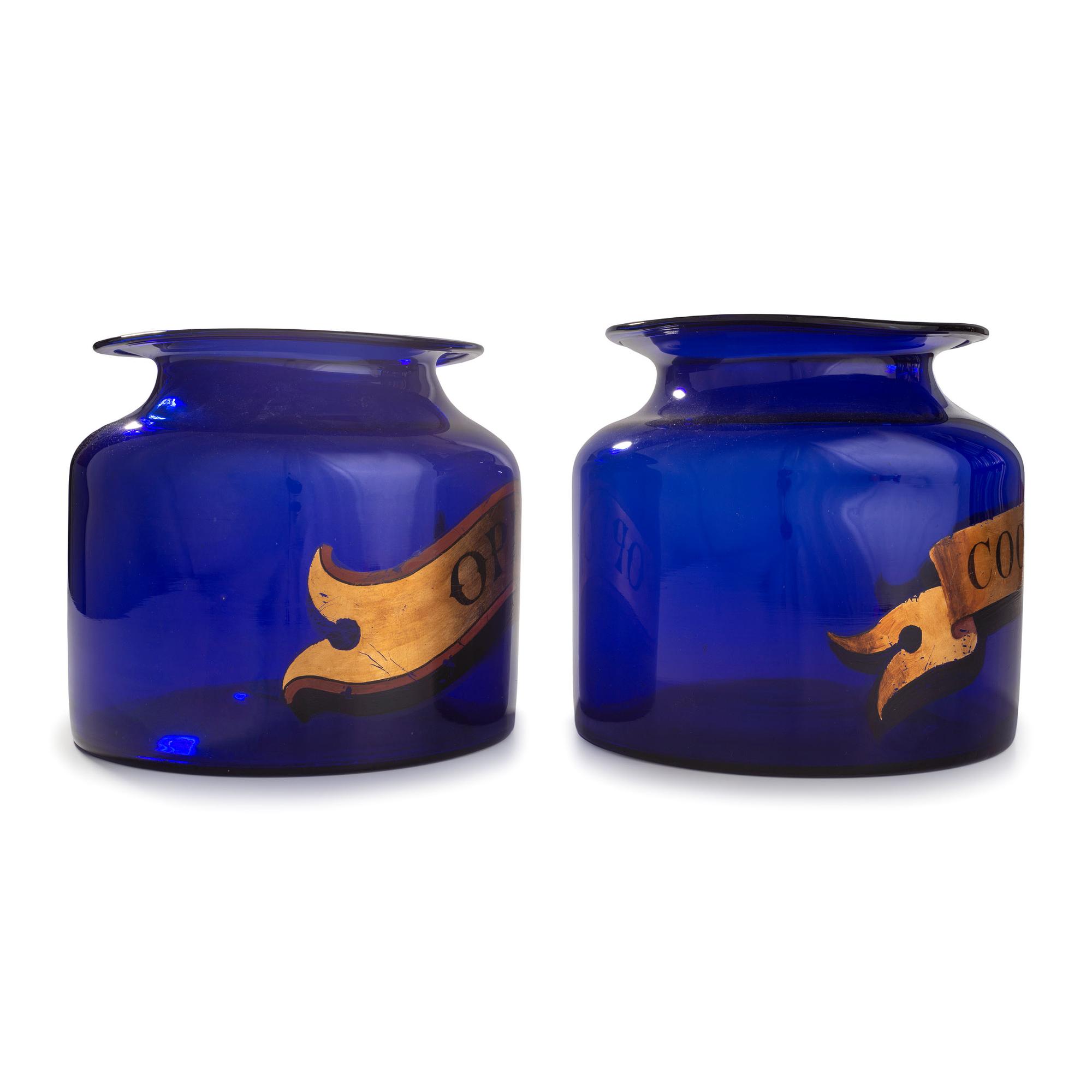 Two Painted Blue Glass Apothecary Jars for Cocaine and Opium