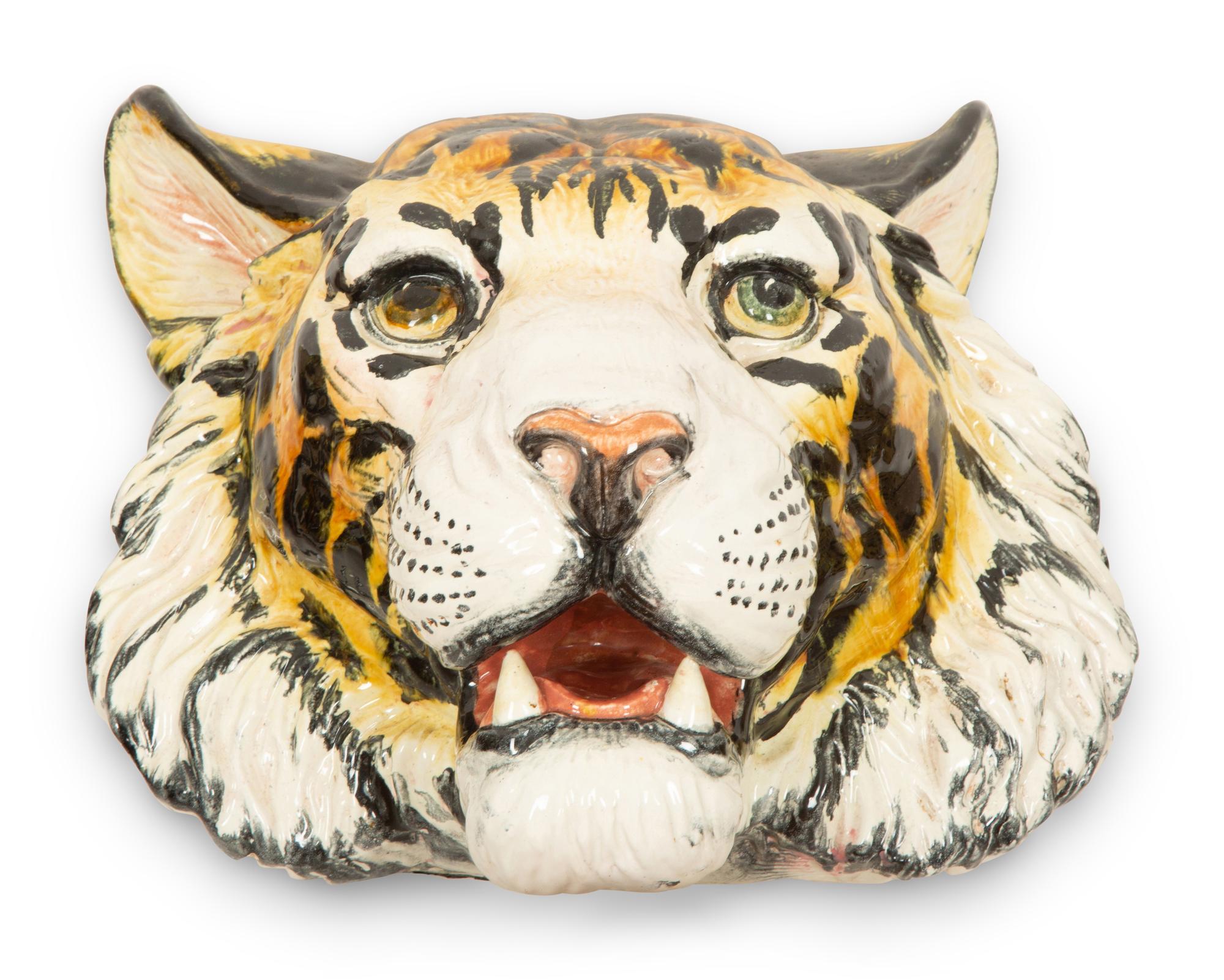 A Group of Six Italian Glazed Terracotta Feline Head Wall Mounts