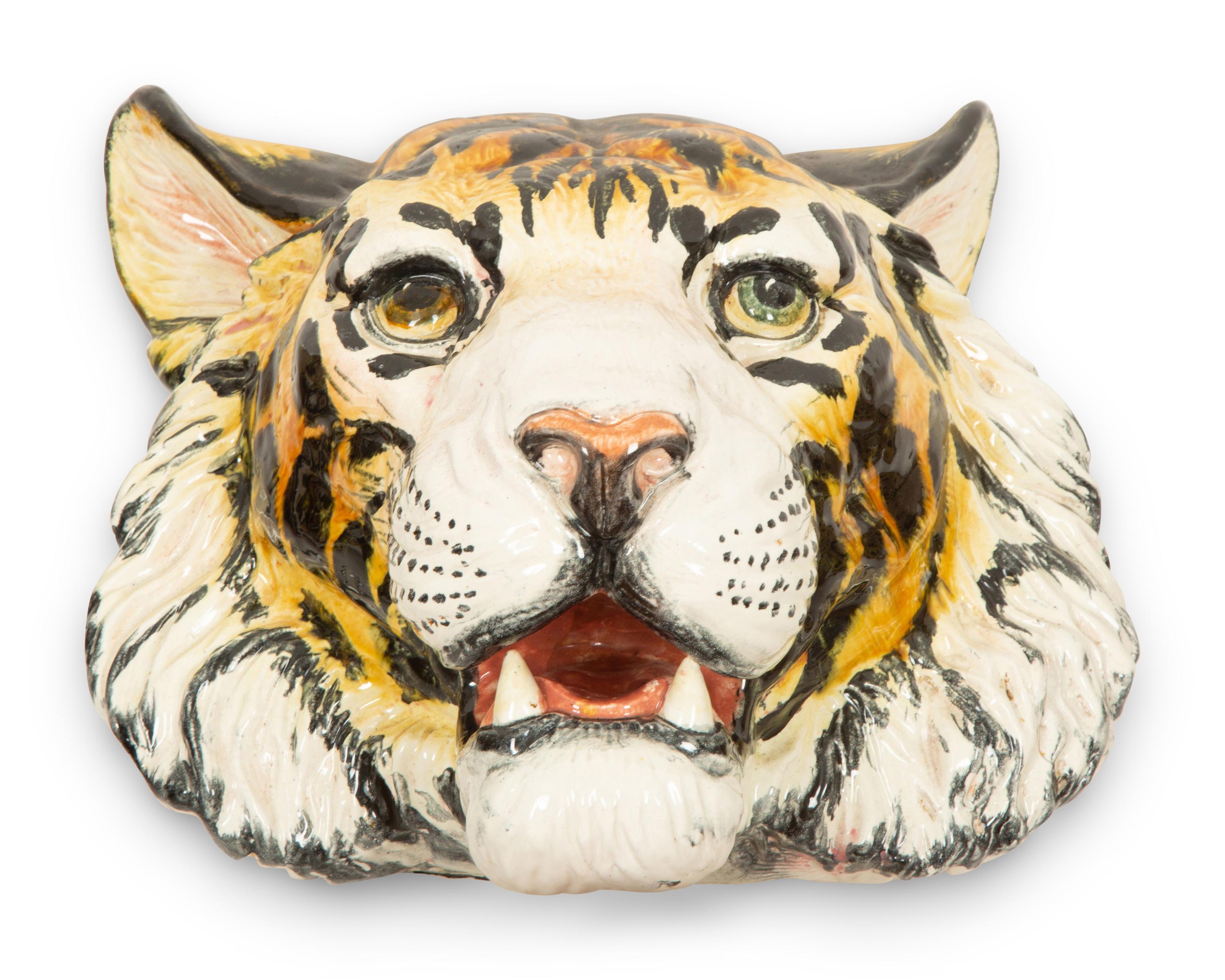 A Group of Six Italian Glazed Terracotta Feline Head Wall Mounts