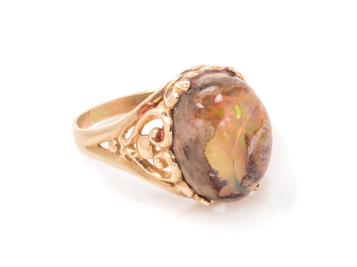 A 14 Karat Yellow Gold and Boulder Opal Ring,