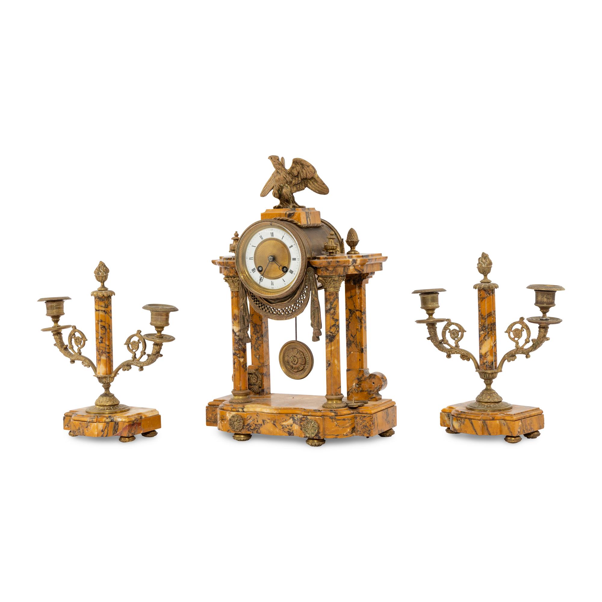 A French Gilt-Bronze and Sienna Marble Three-Piece Clock Garniture