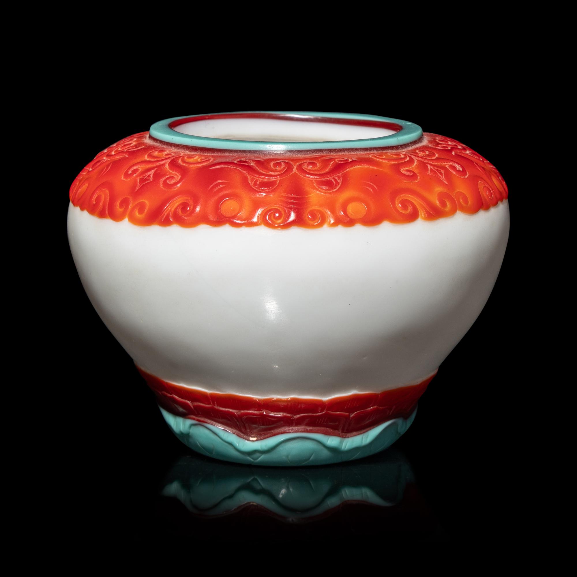 A Chinese Turquoise and Ruby Overlay White Glass Water Pot, Qianlong Mark and Period 清乾隆 白地套彩料饕餮蓮紋水盂