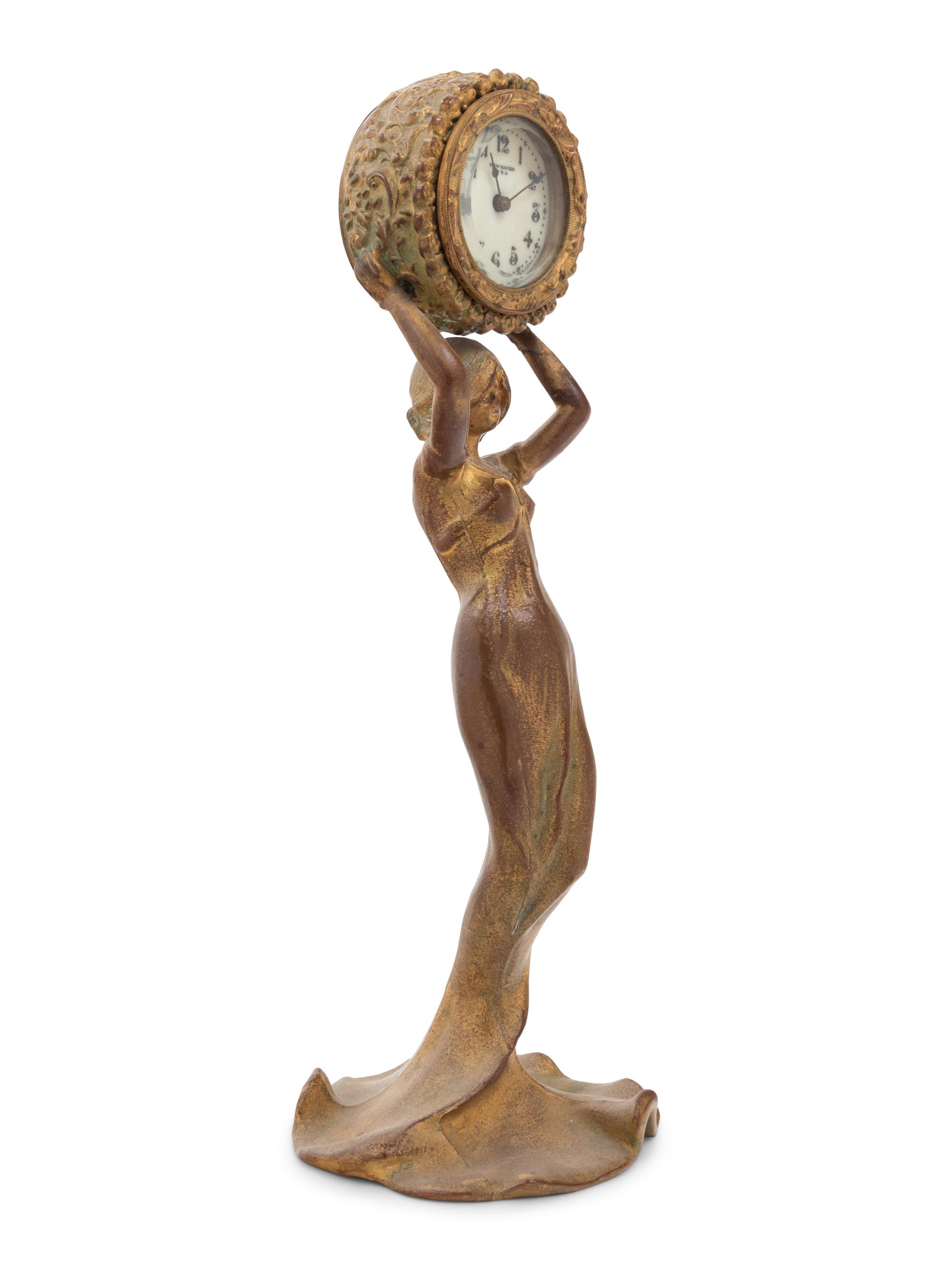 A New Haven Clock Co. Gilt Metal Figural Table Clock