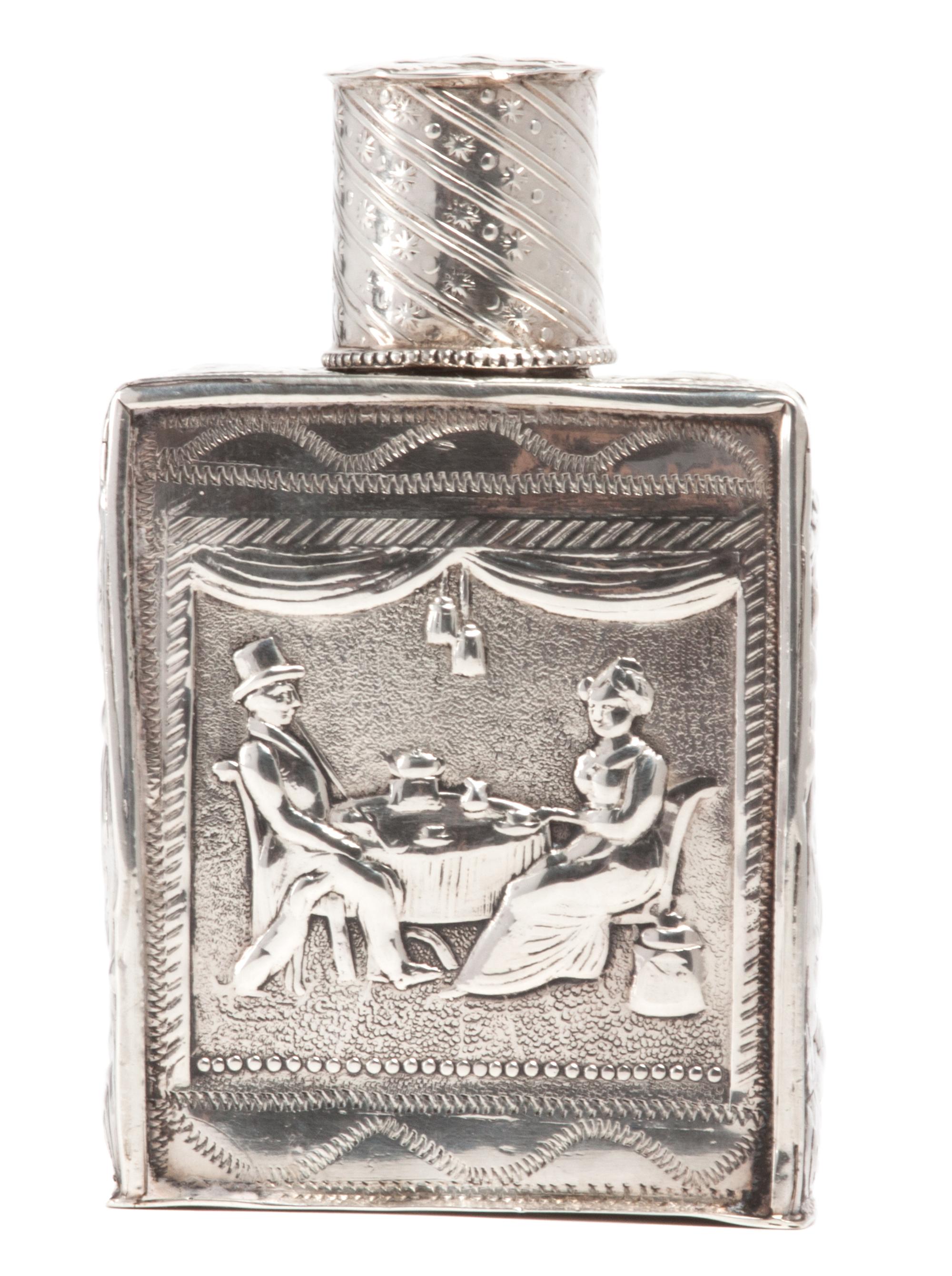 A German Silver Allegorical Bottle with Lid, , of rectangular form with chased figural decoration, inscribed on bottom.