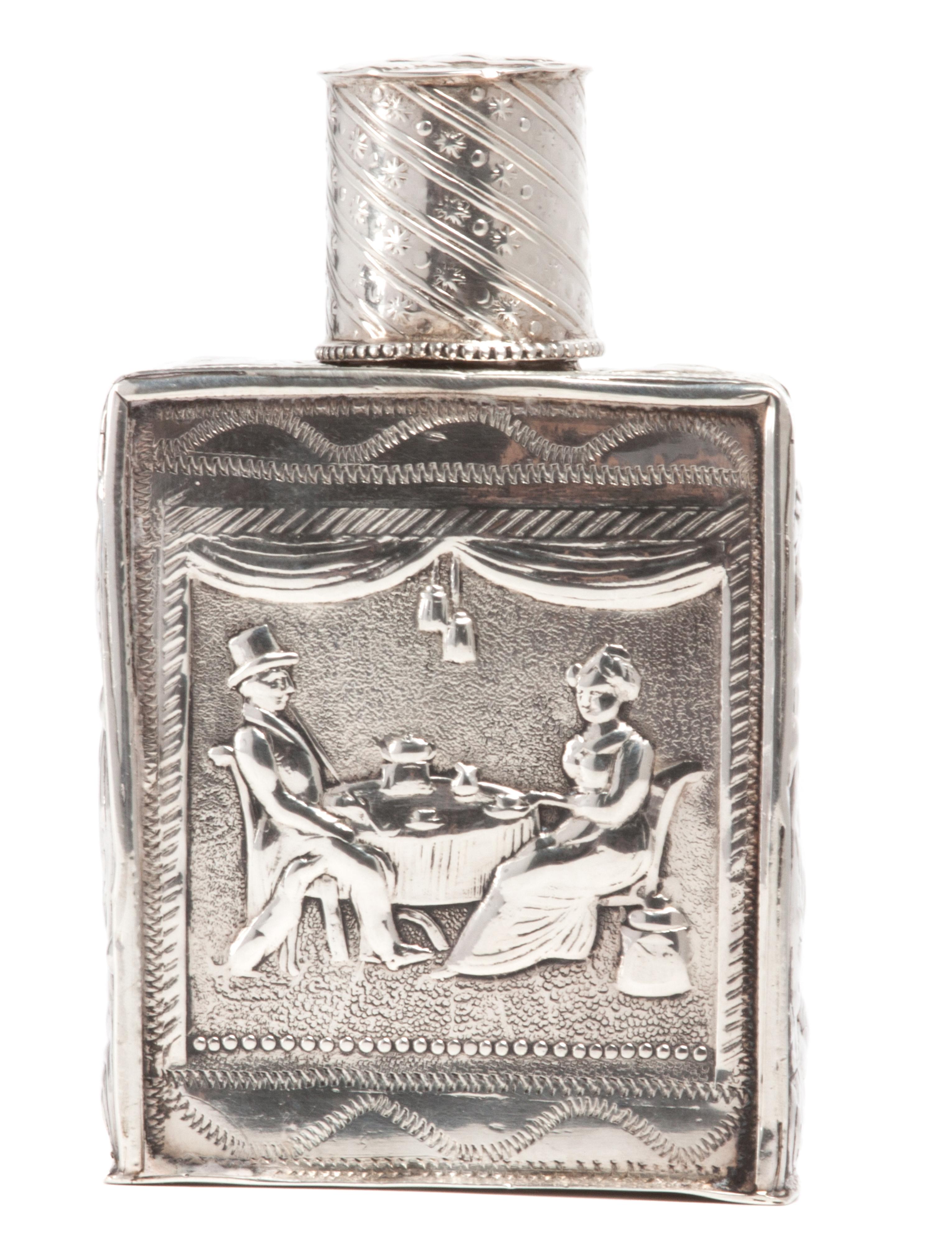 A German Silver Allegorical Bottle with Lid, , of rectangular form with chased figural decoration, inscribed on bottom.