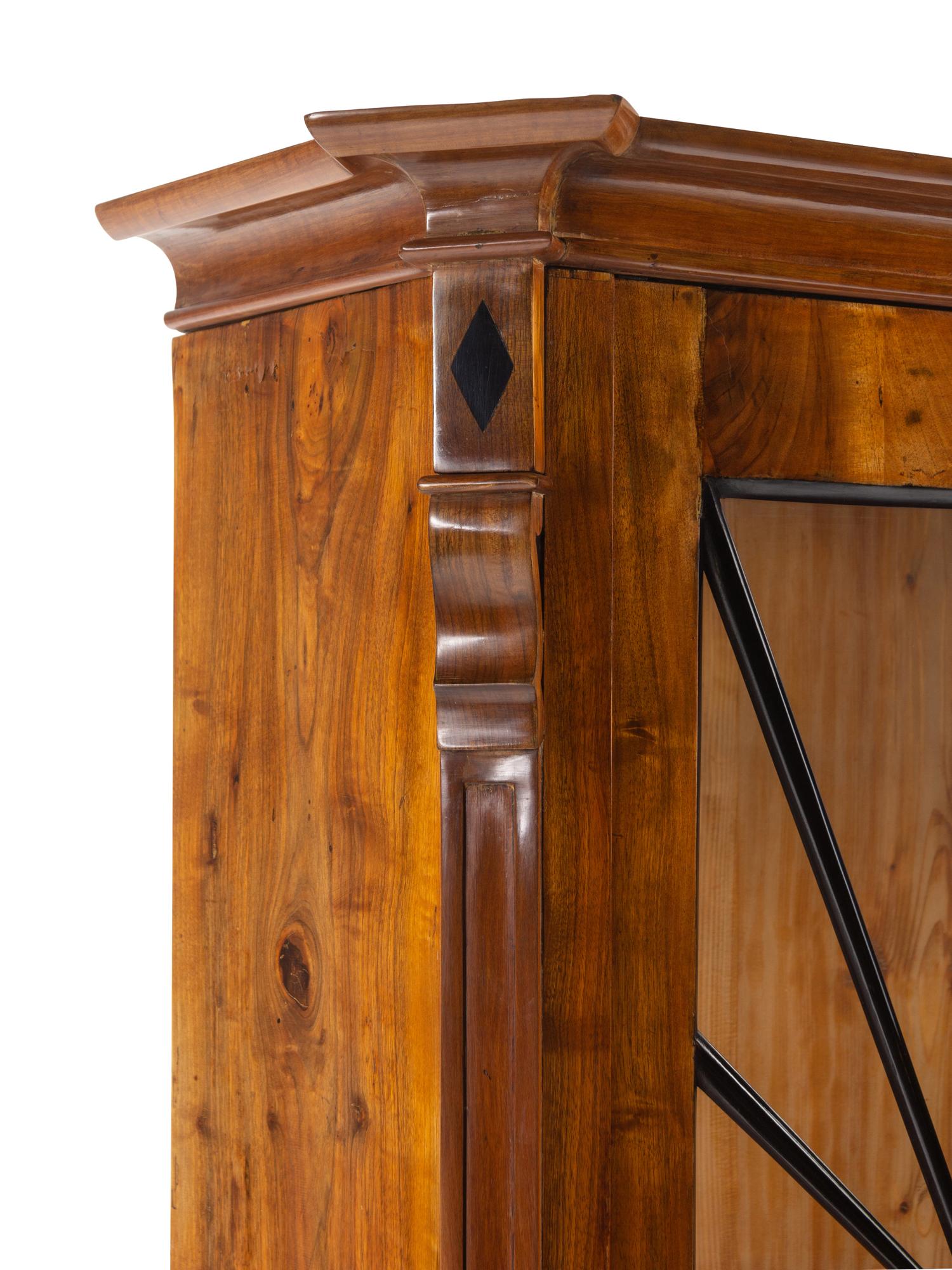 A Biedermeier Part-Ebonized Figured Walnut Bookcase
