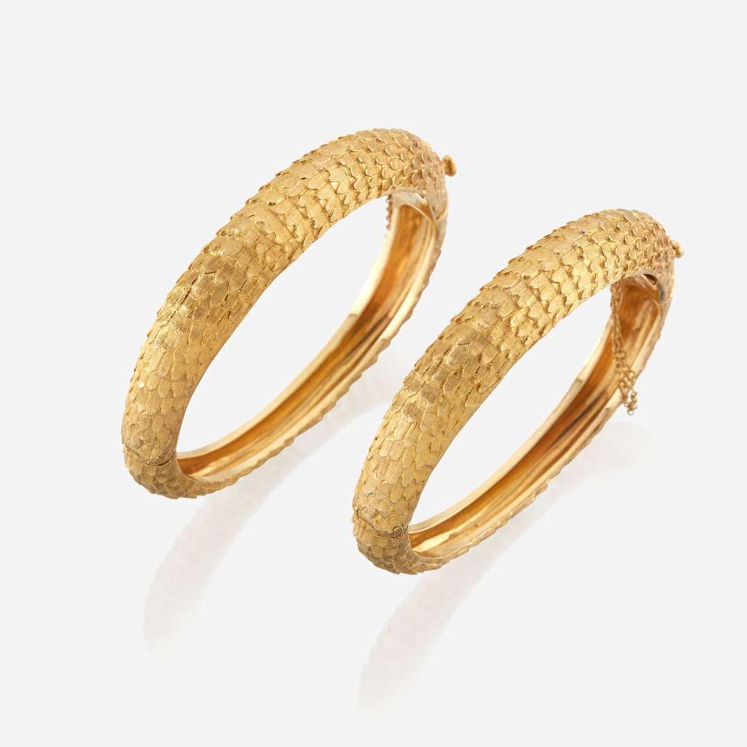 A pair of gold bracelets