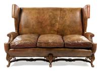 An English Leather Wingback Sofa Height 49 x width 70 x depth 37 1/2 inches. — LATE 19TH/EARLY 20TH CENTURY