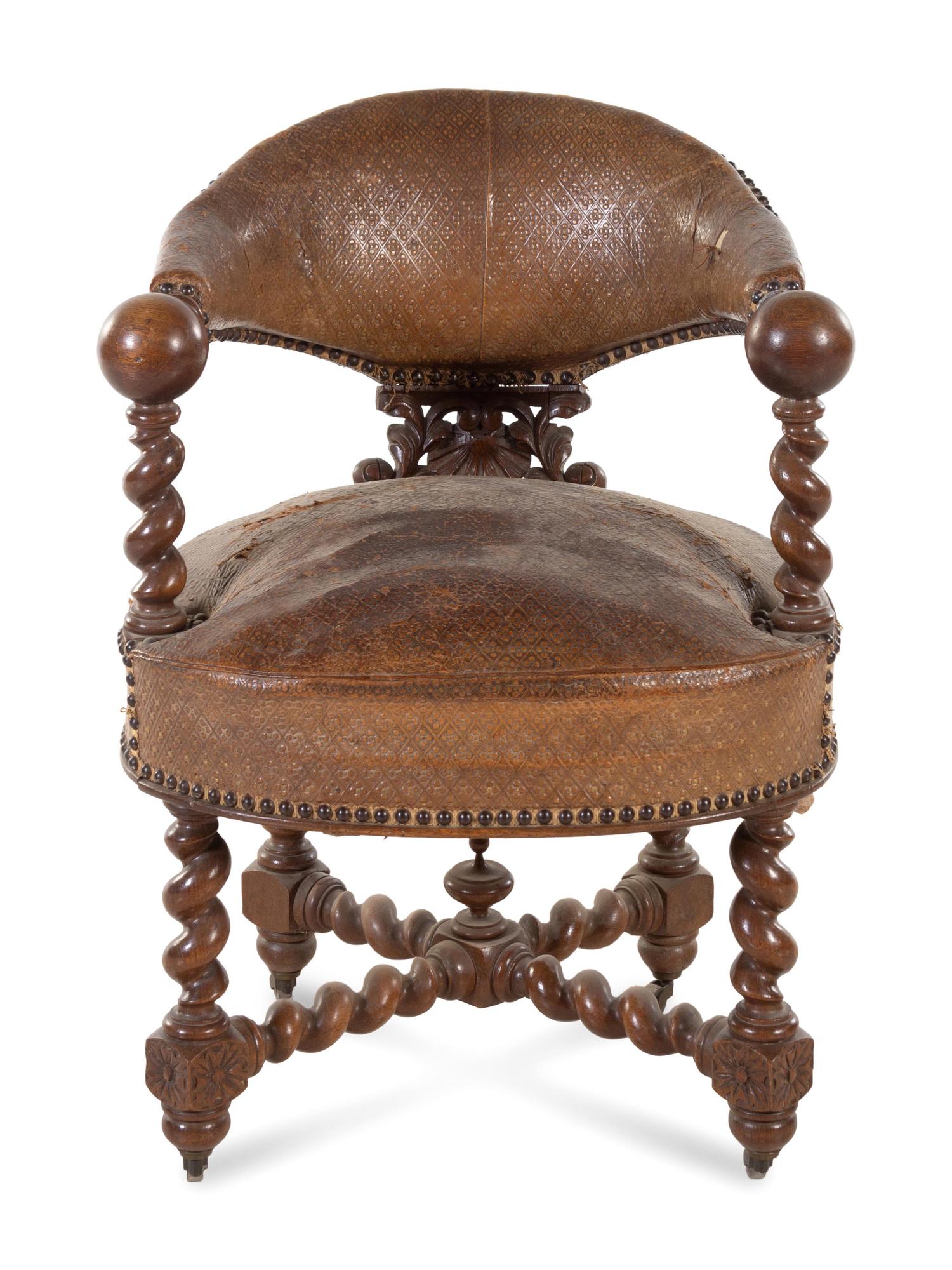 A Continental Renaissance Revival Carved Walnut Armchair