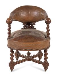 A Continental Renaissance Revival Carved Walnut Armchair