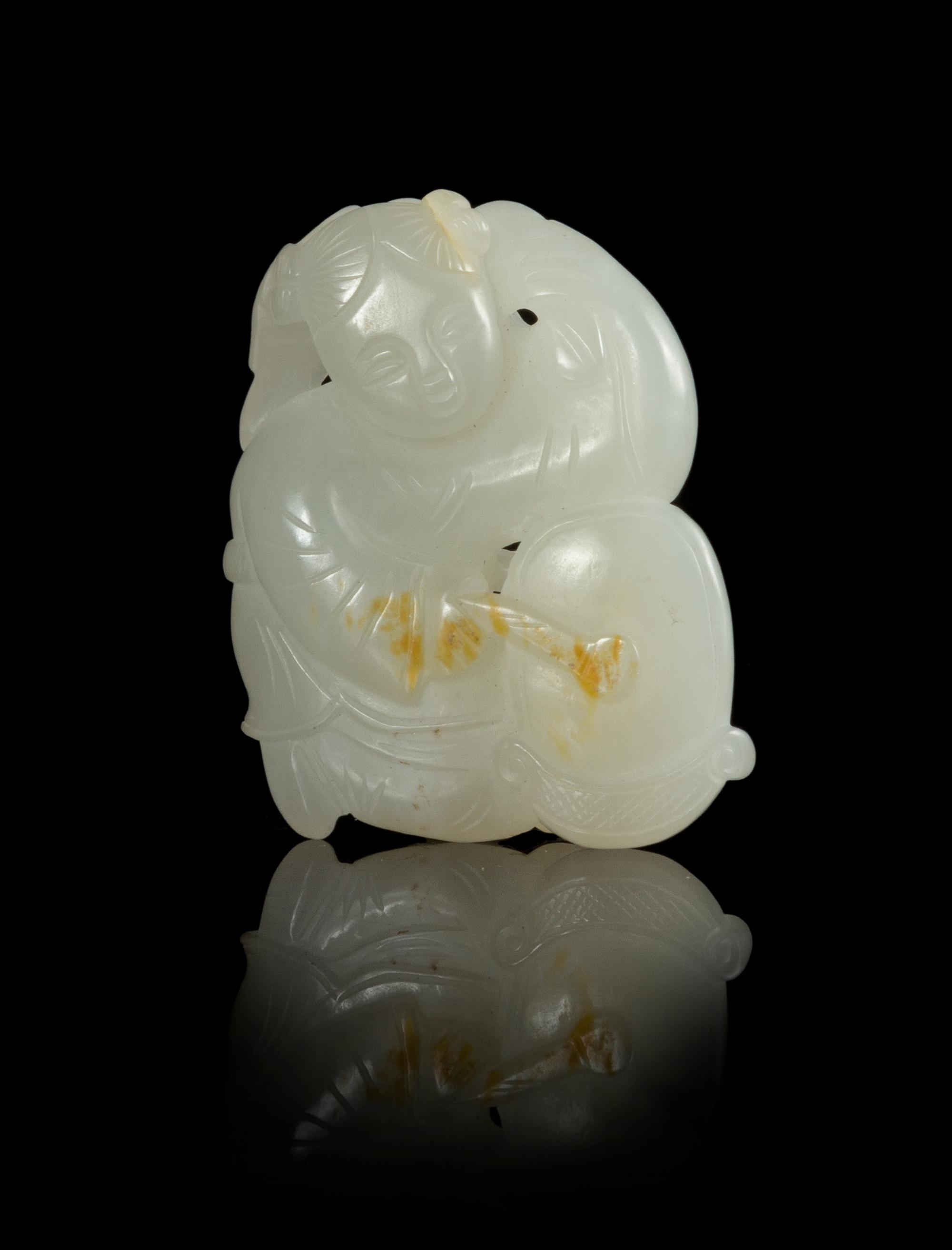 A Carved Jade Pendant Length 2 inches.