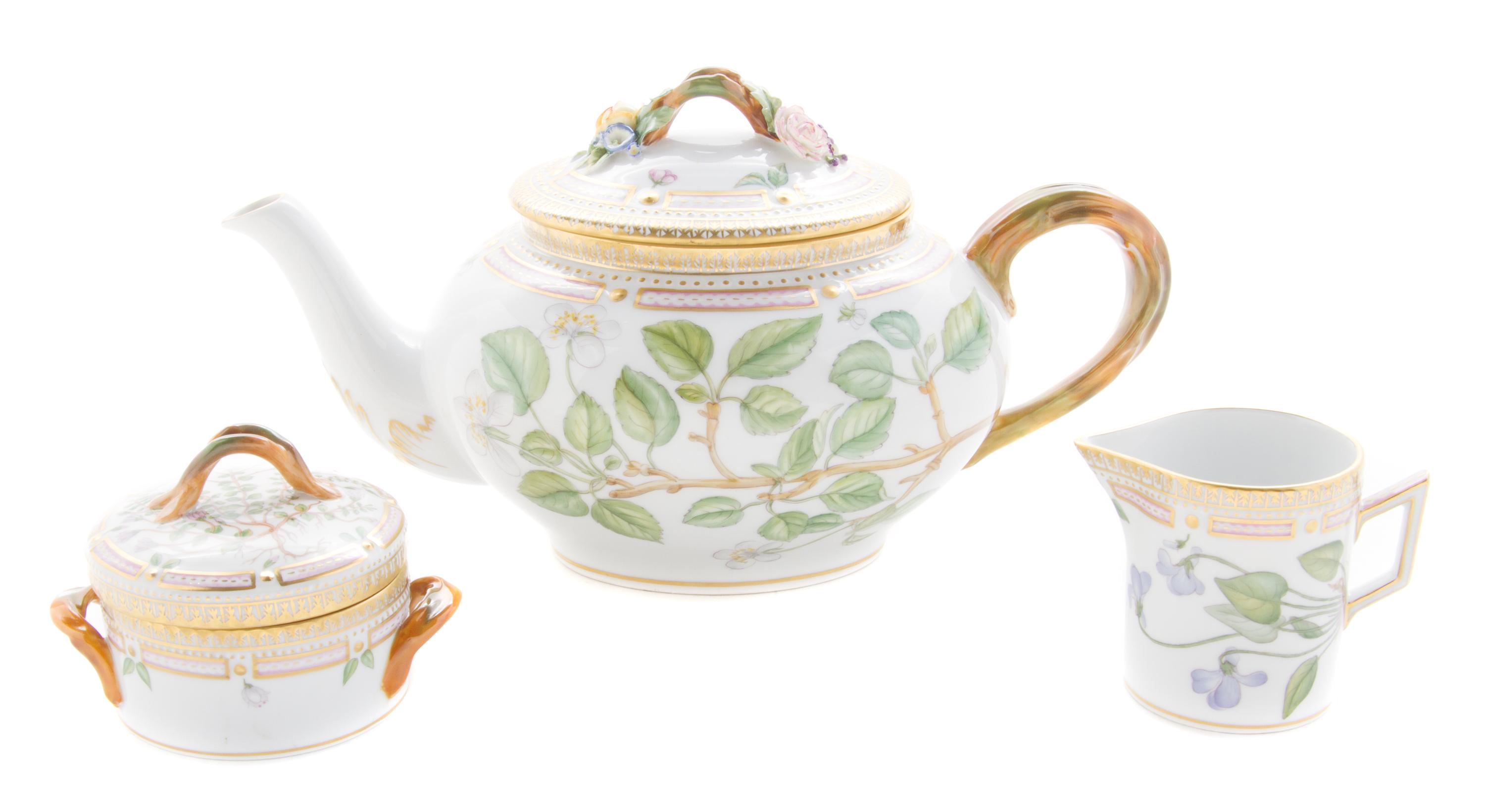 A Royal Copenhagen Flora Danica Teapot, Covered Sugar and Creamer Width of teapot over handle 11 1/2 inches.