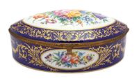 A French Hand Painted Porcelain Gilt Metal Mounted Oval Box Height 4 3/4 x width 14 x depth 10 1/4 inches. — 19TH CENTURY