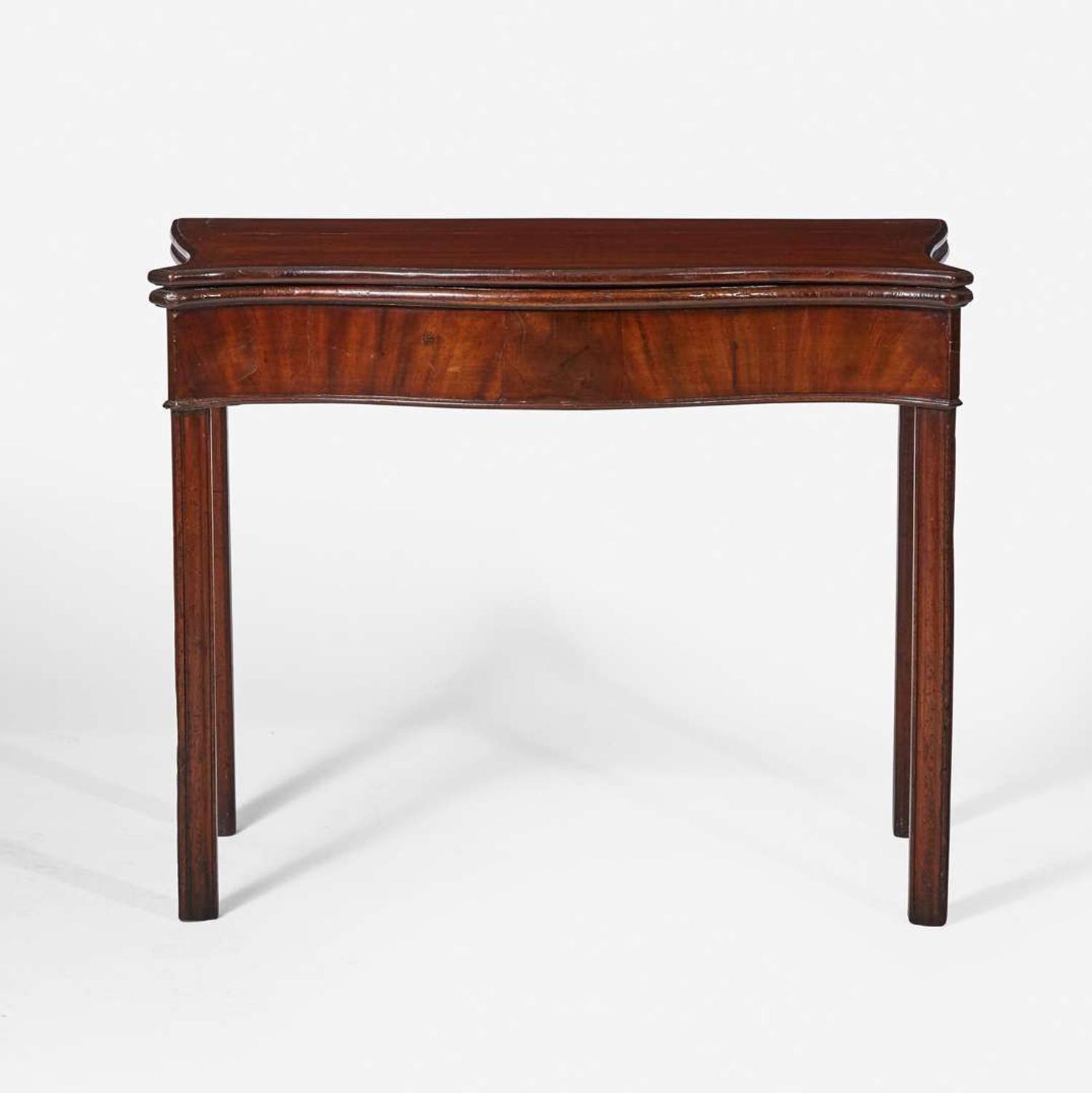 A George III serpentine carved mahogany card table circa 1770