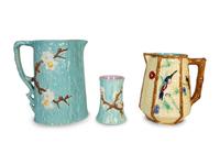 A Holdcroft English Majolica Turquoise Dogwood Pitcher and Cup and a Fielding Majolica Hummingbird Pitcher — 19th Century