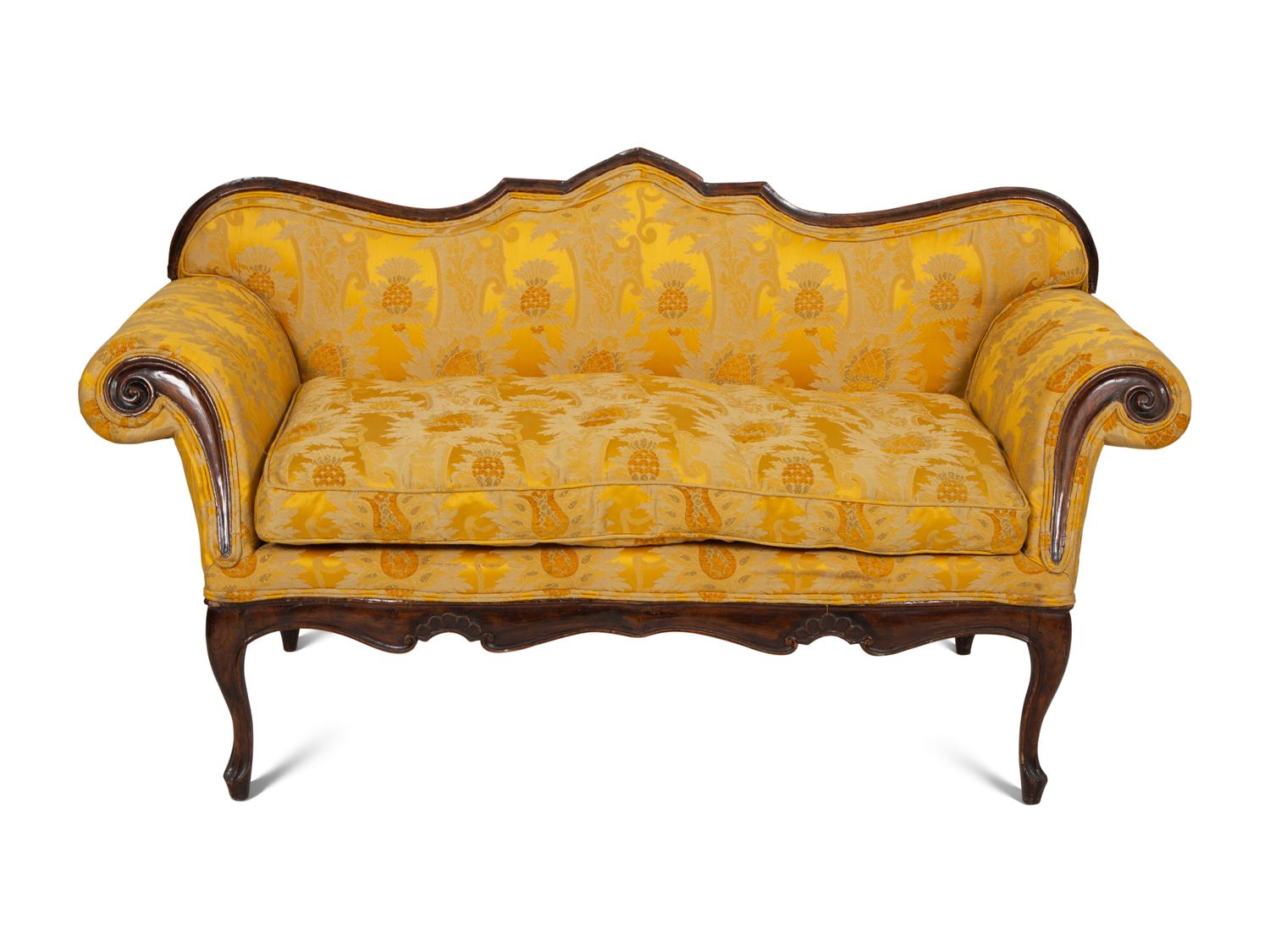 A Louis XV Provincial Carved Walnut Settee
