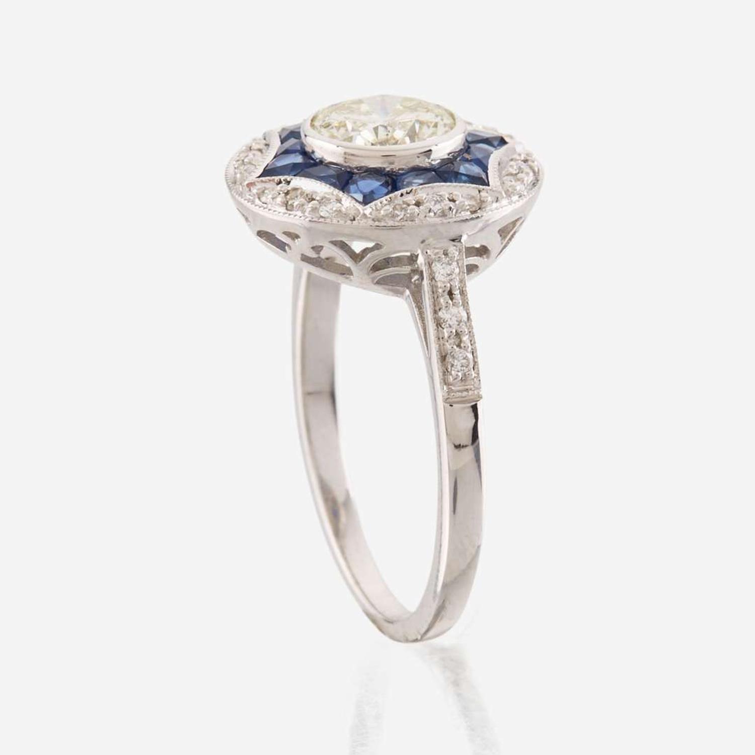 A diamond, sapphire, and white gold ring