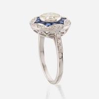 A diamond, sapphire, and white gold ring