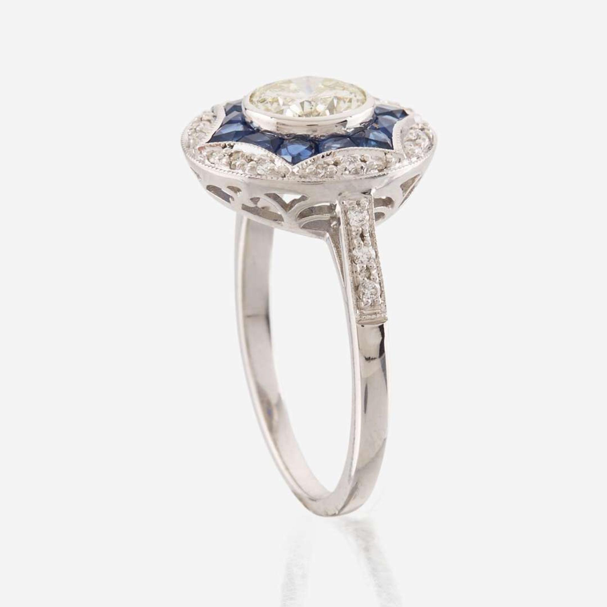 A diamond, sapphire, and white gold ring