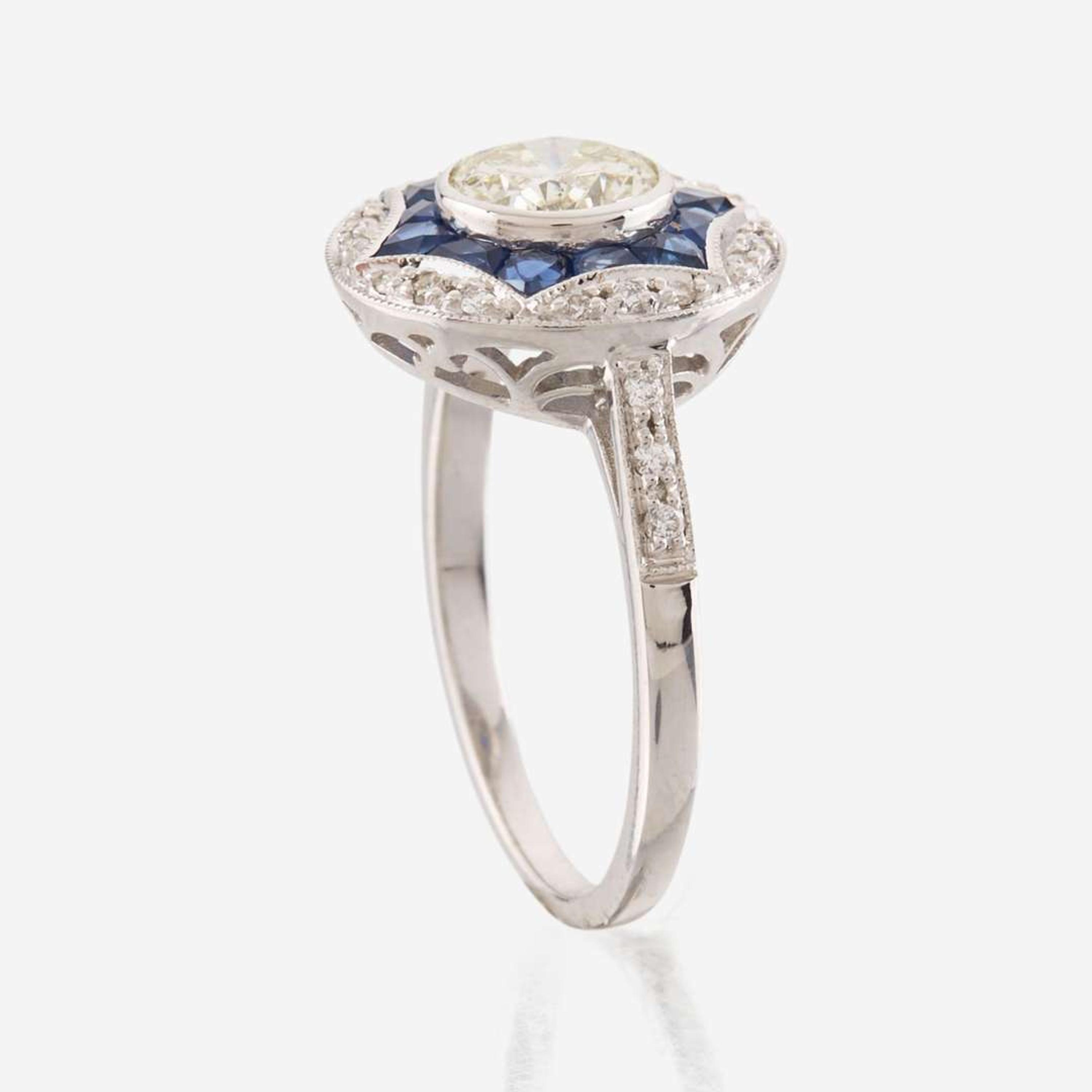 A diamond, sapphire, and white gold ring