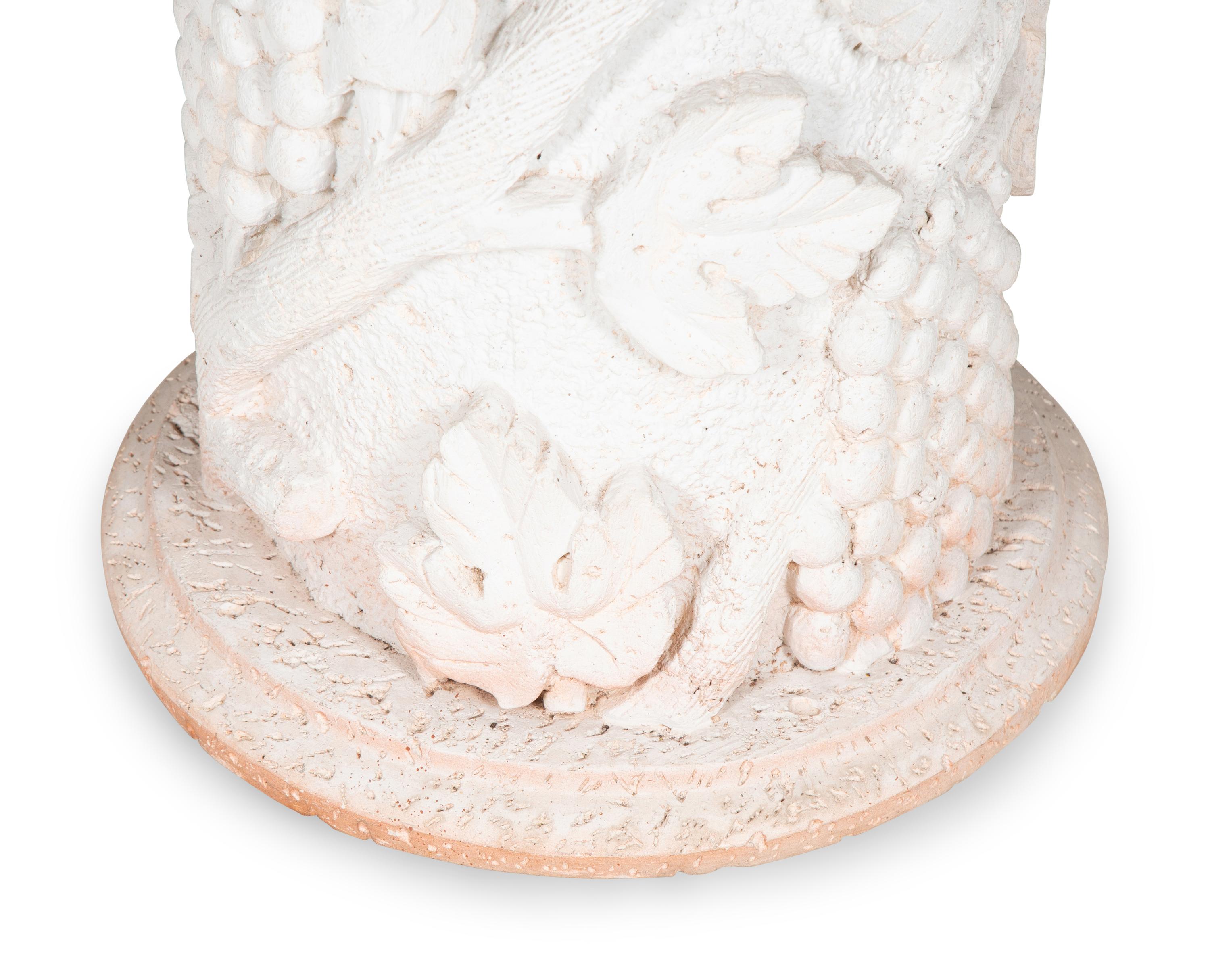 A Cast Stone and Pietra Dura Circular Dining Table