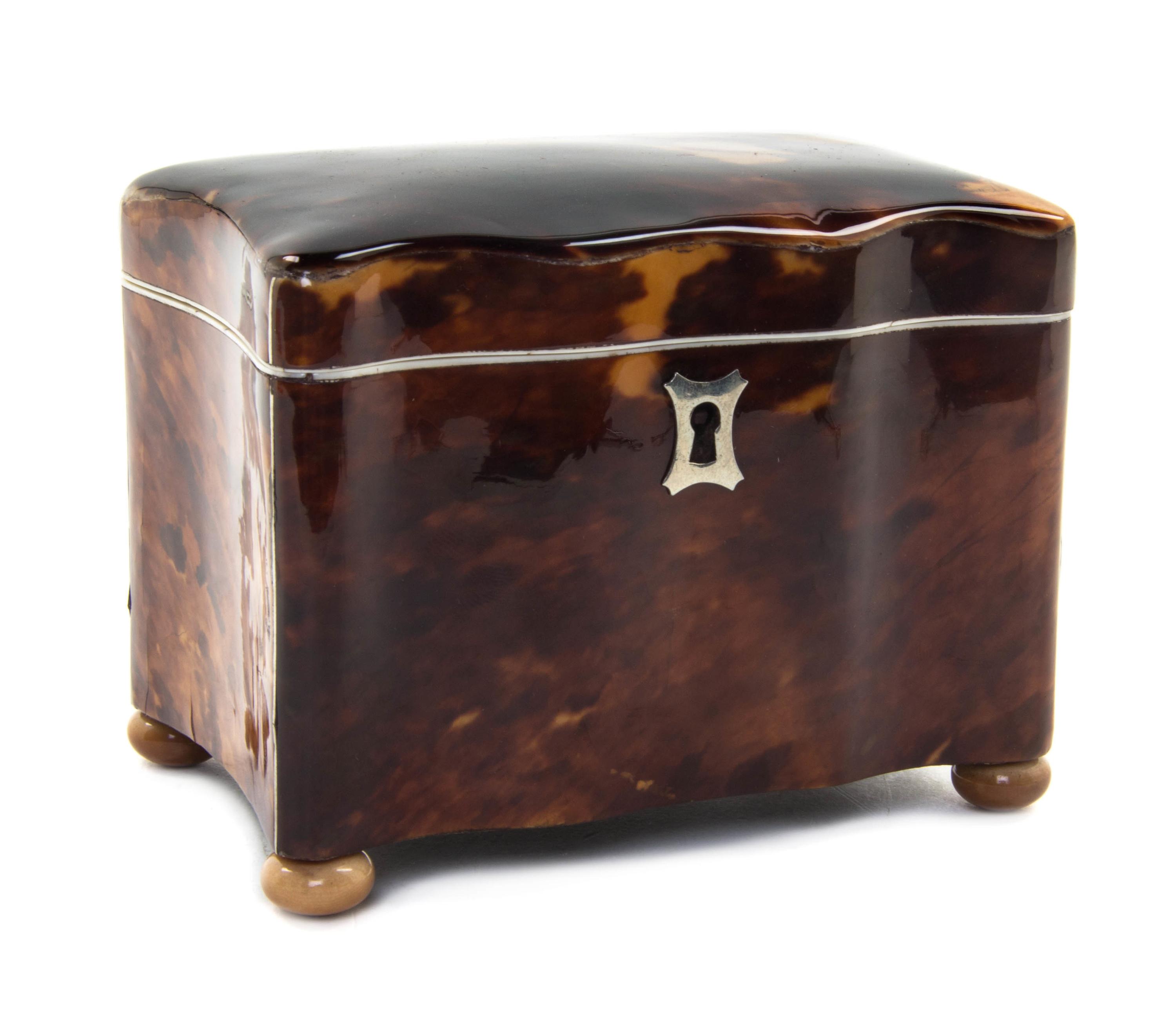 An English Tortoise Shell Tea Caddy, Height 3 3/4 x width 4 1/2 x depth 3 inches.