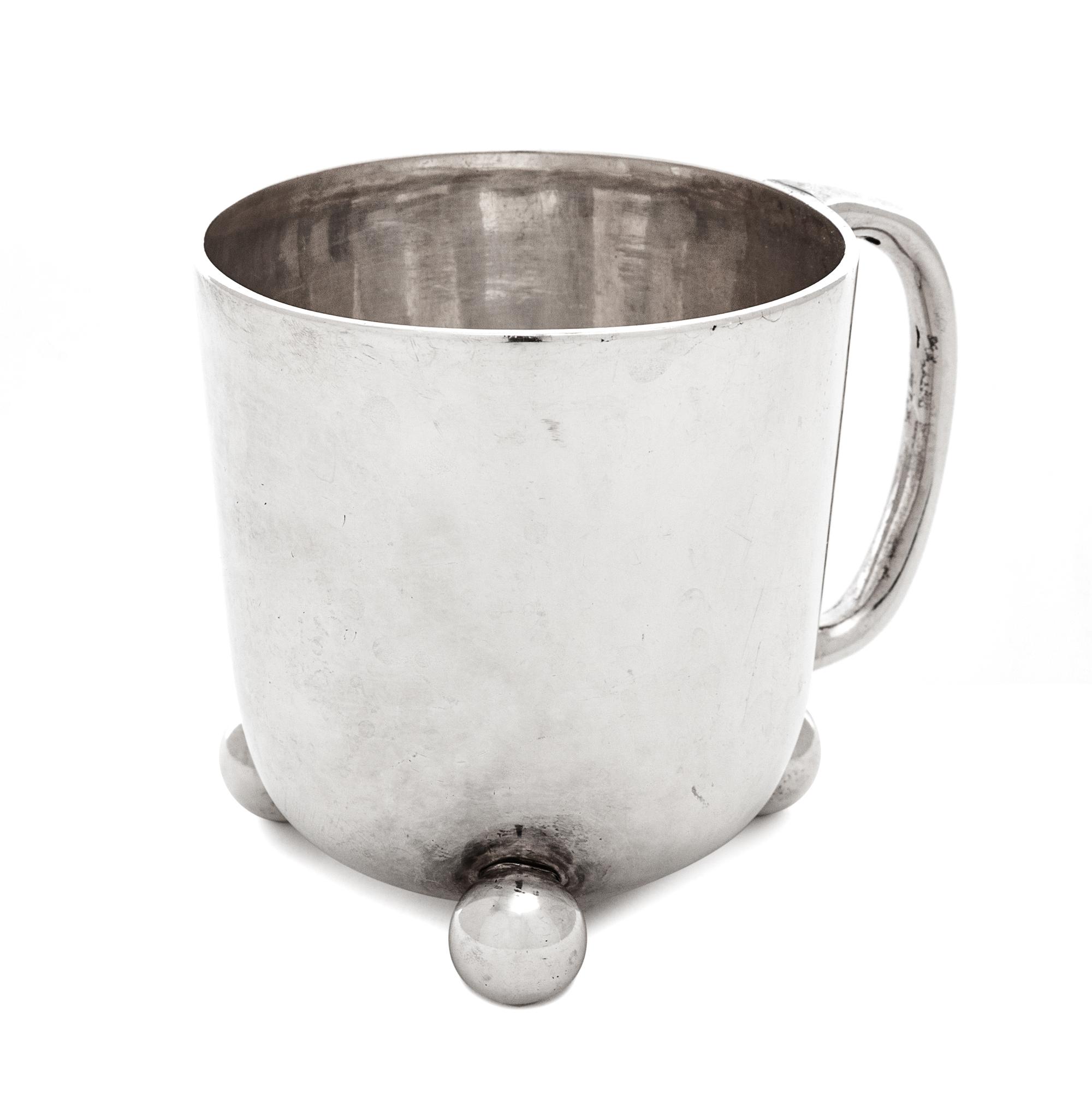 A Victorian Silver Children's Mug, William Hutton & Son, London, 1870, Raised on three ball feet.