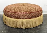 An Upholstered Ottoman Diameter 41 1/2 inches. — 20TH CENTURY