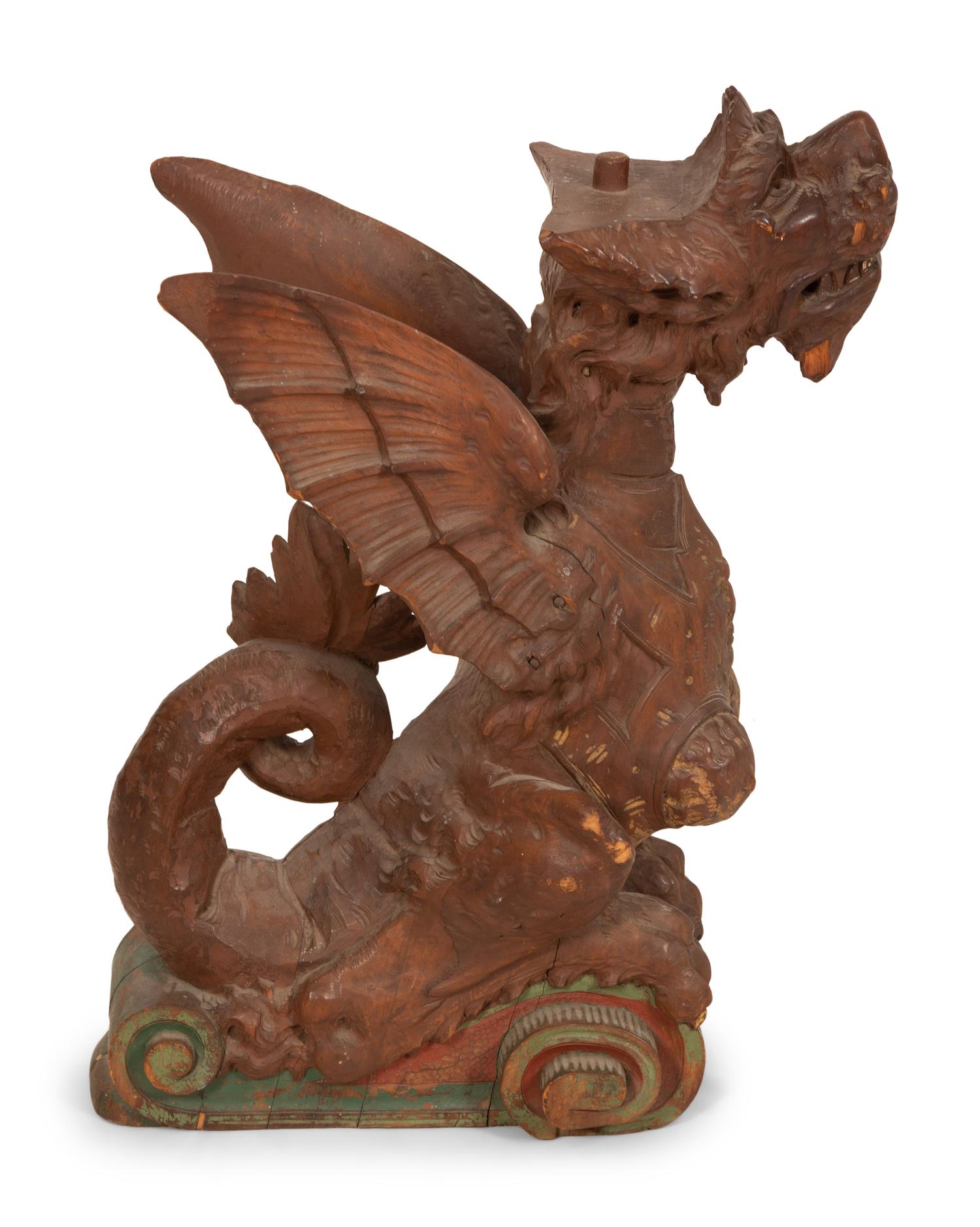 An Italian Carved and Polychromed Seated Dragon