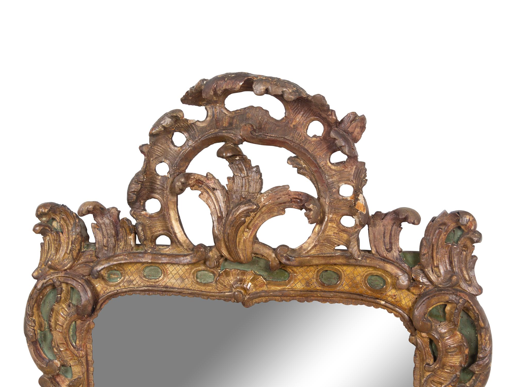 A Régence Carved and Painted Giltwood Mirror